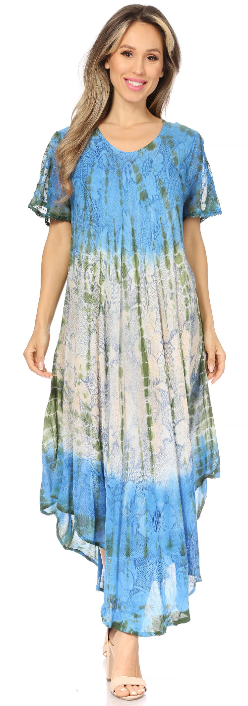 Woman wearing a blue and gray tie-dye dress with a plain background
