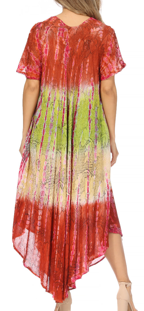 Woman wearing a tie-dye dress with red, green, and pink gradient.