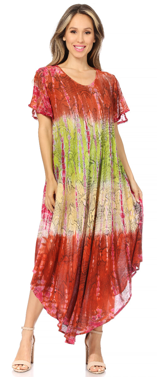 Woman wearing a colorful tie-dye dress with a gradient from red to green.