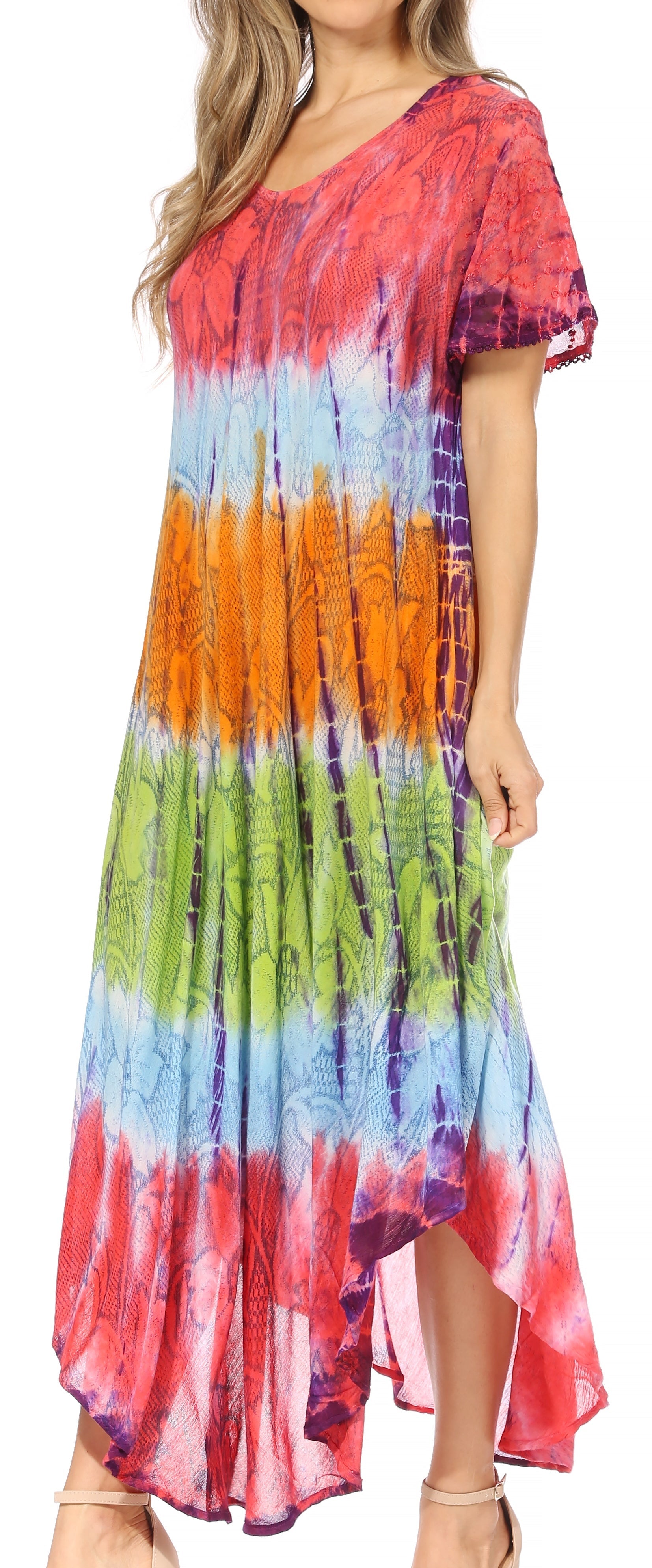 Woman wearing a colorful tie-dye dress with a blurred background