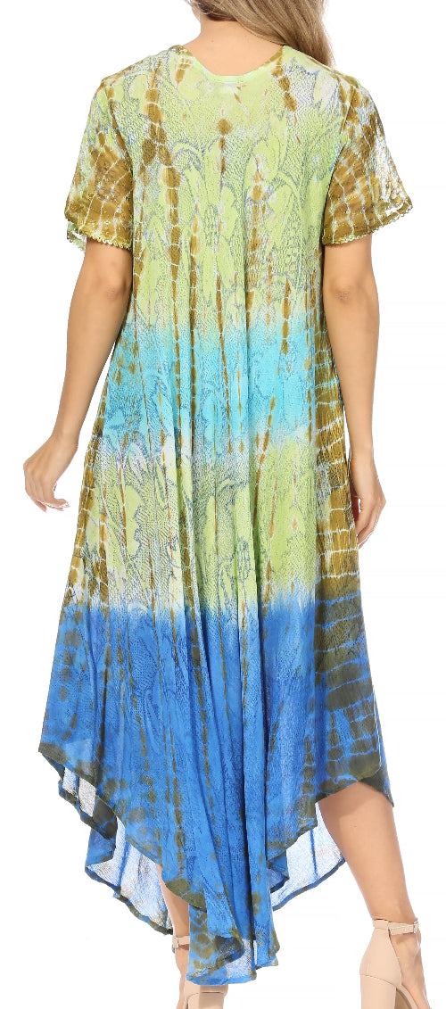 Woman wearing a tie-dye dress with a gradient from green to blue.