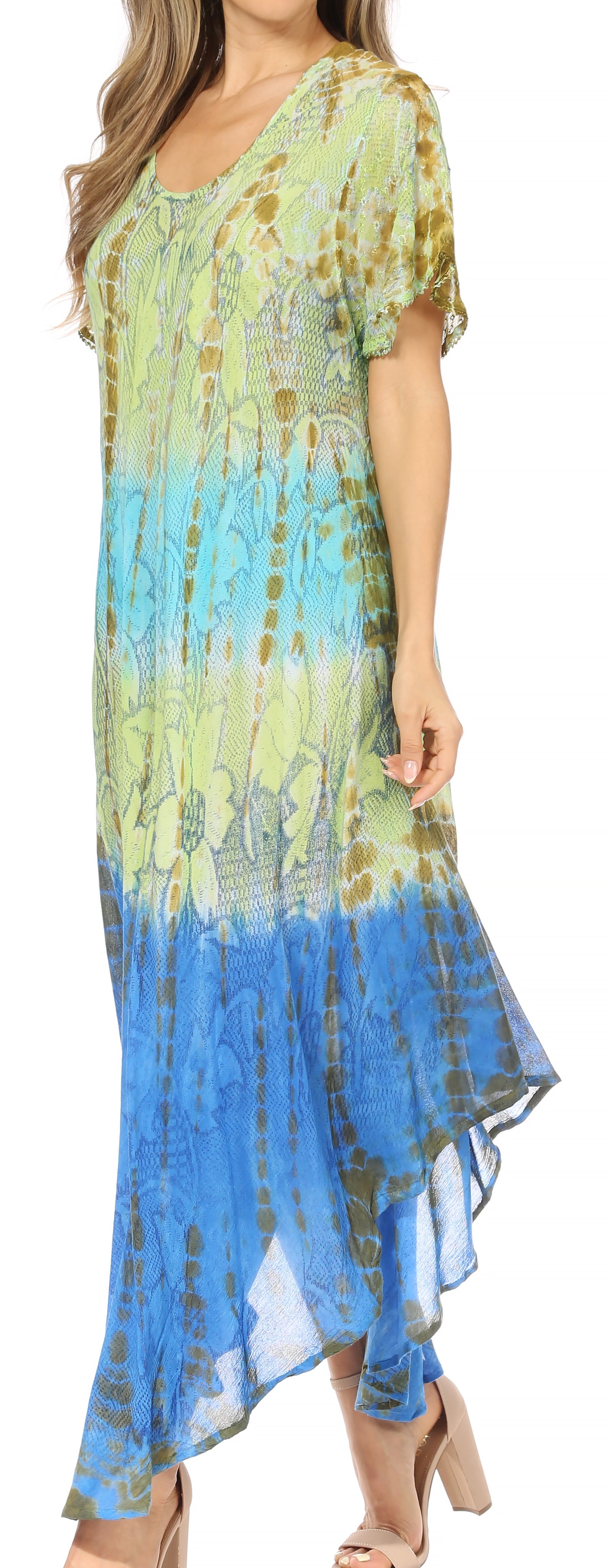 Woman wearing a tie-dye dress with blue and green gradient.