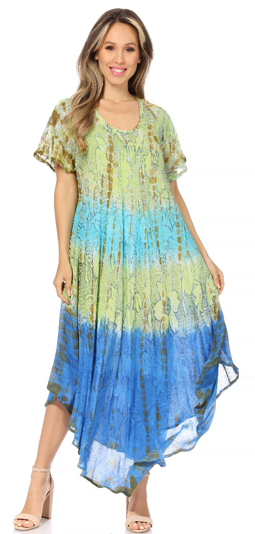 Woman wearing a tie-dye dress with a gradient from green to blue on a white background