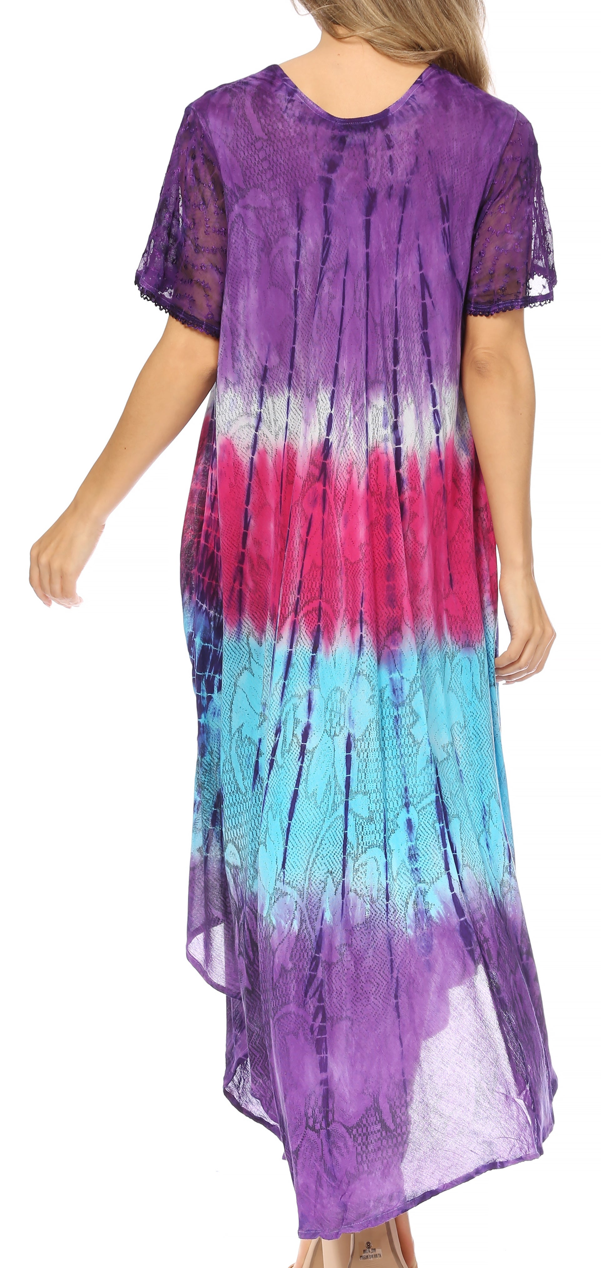 Woman wearing a tie-dye dress with purple, pink, and blue gradient on a white background