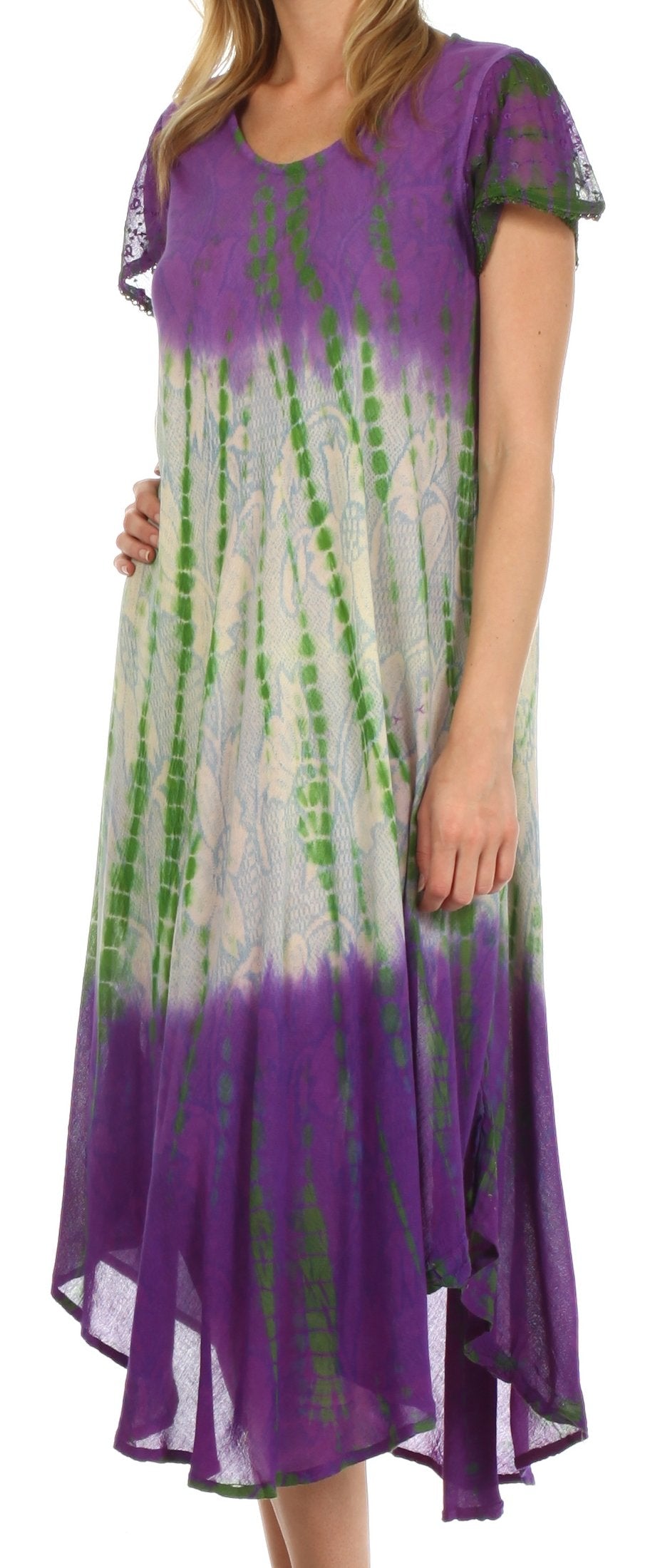 Woman wearing a tie-dye dress with purple and green patterns.