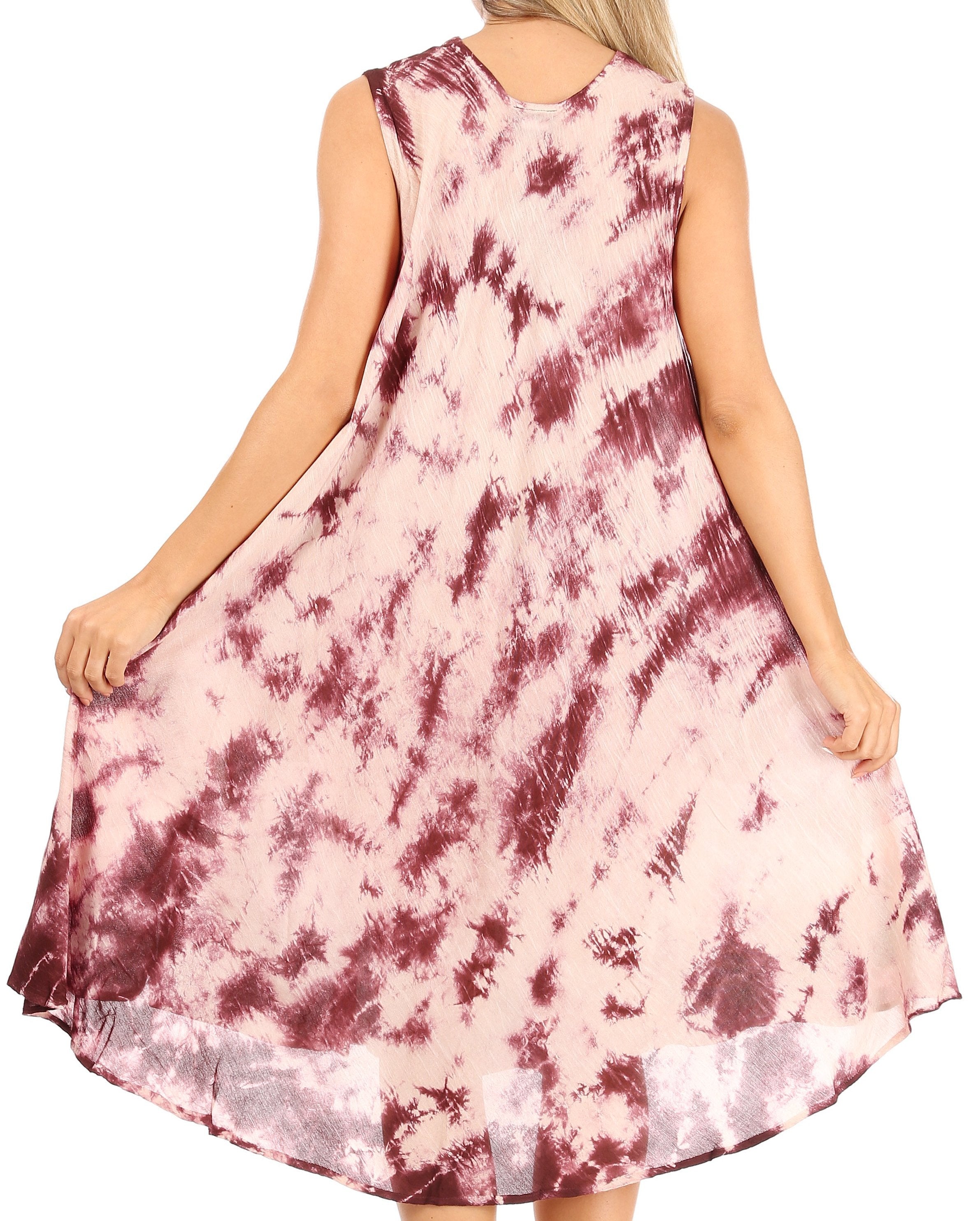 Pink and red tie-dye dress worn by a person on a white background