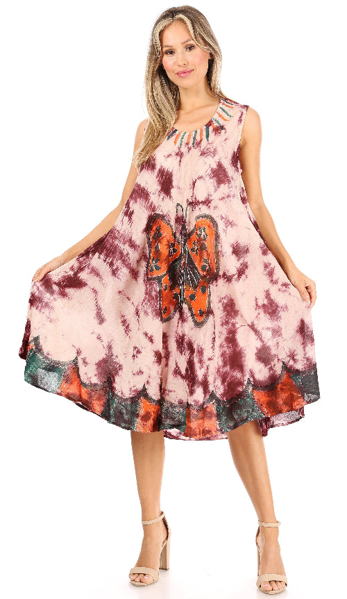 Woman wearing a tie-dye dress with a butterfly design on a white background