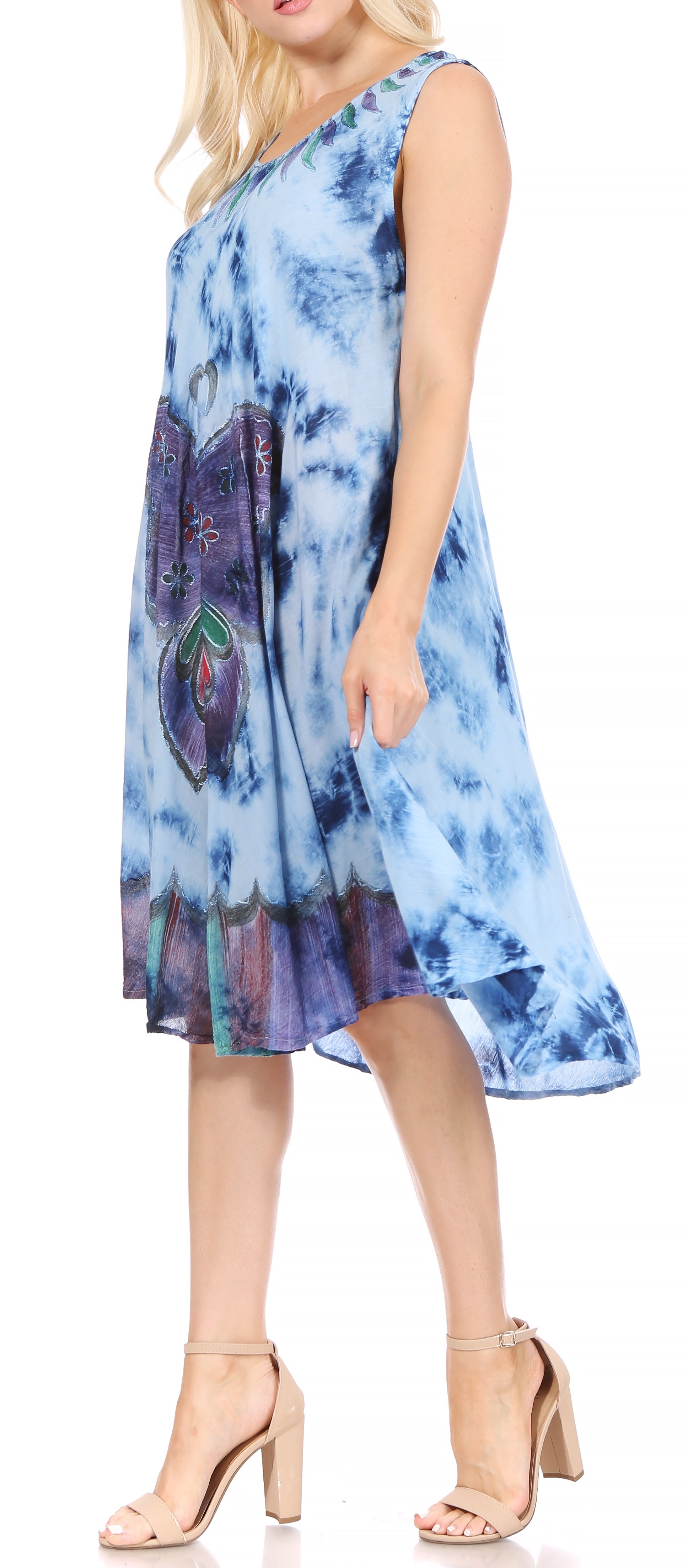 Woman wearing a blue tie-dye dress on a white background