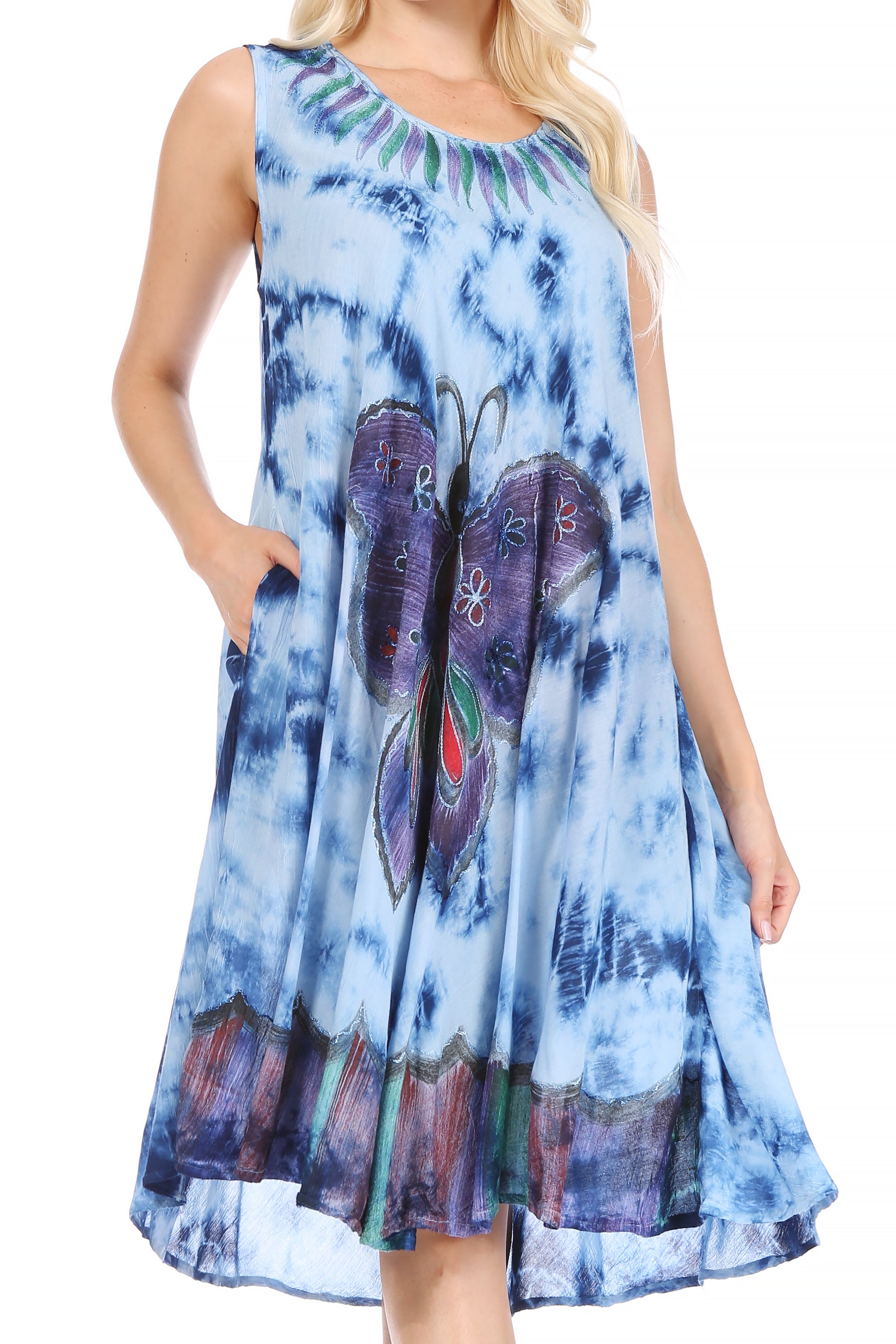Woman wearing a blue tie-dye dress with butterfly design on a white background