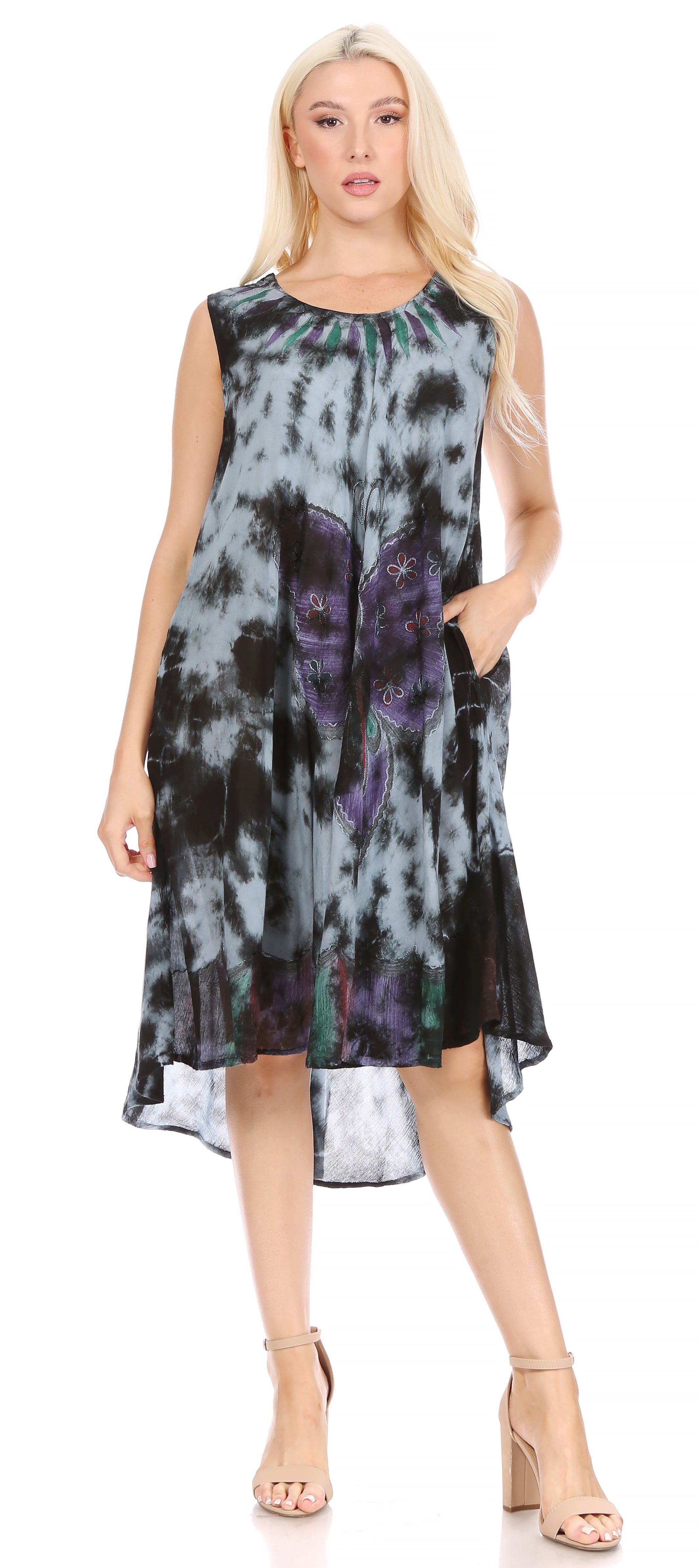 Woman wearing a sleeveless dress with tie-dye pattern on a white background
