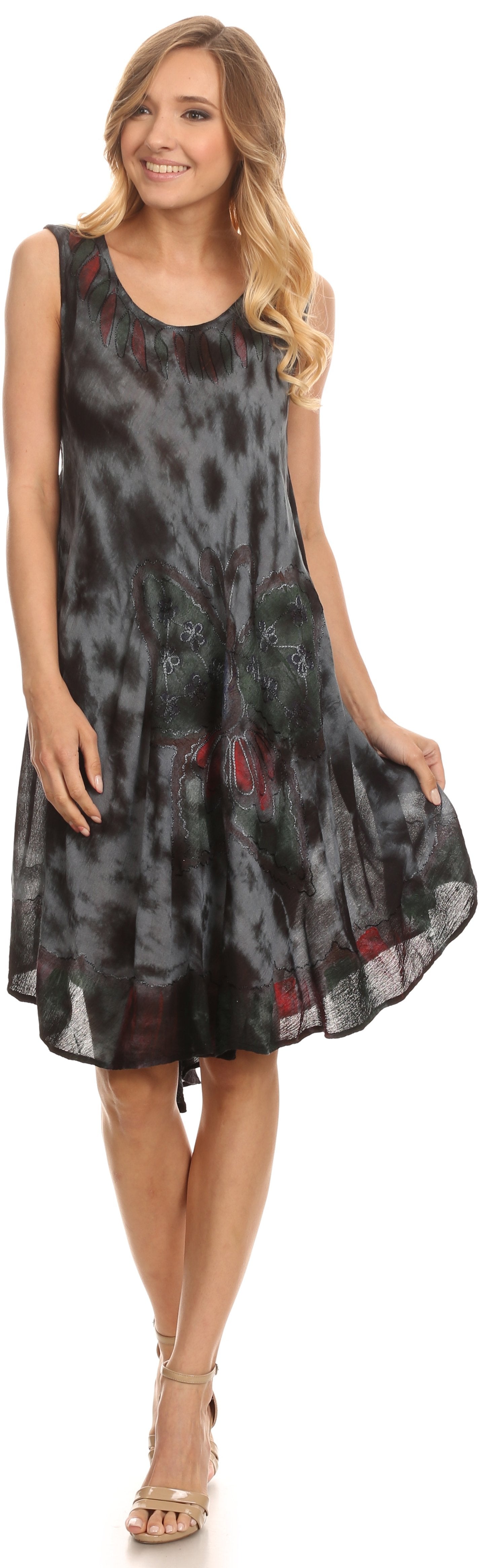 Woman wearing a sleeveless dress with a black and red pattern on a white background