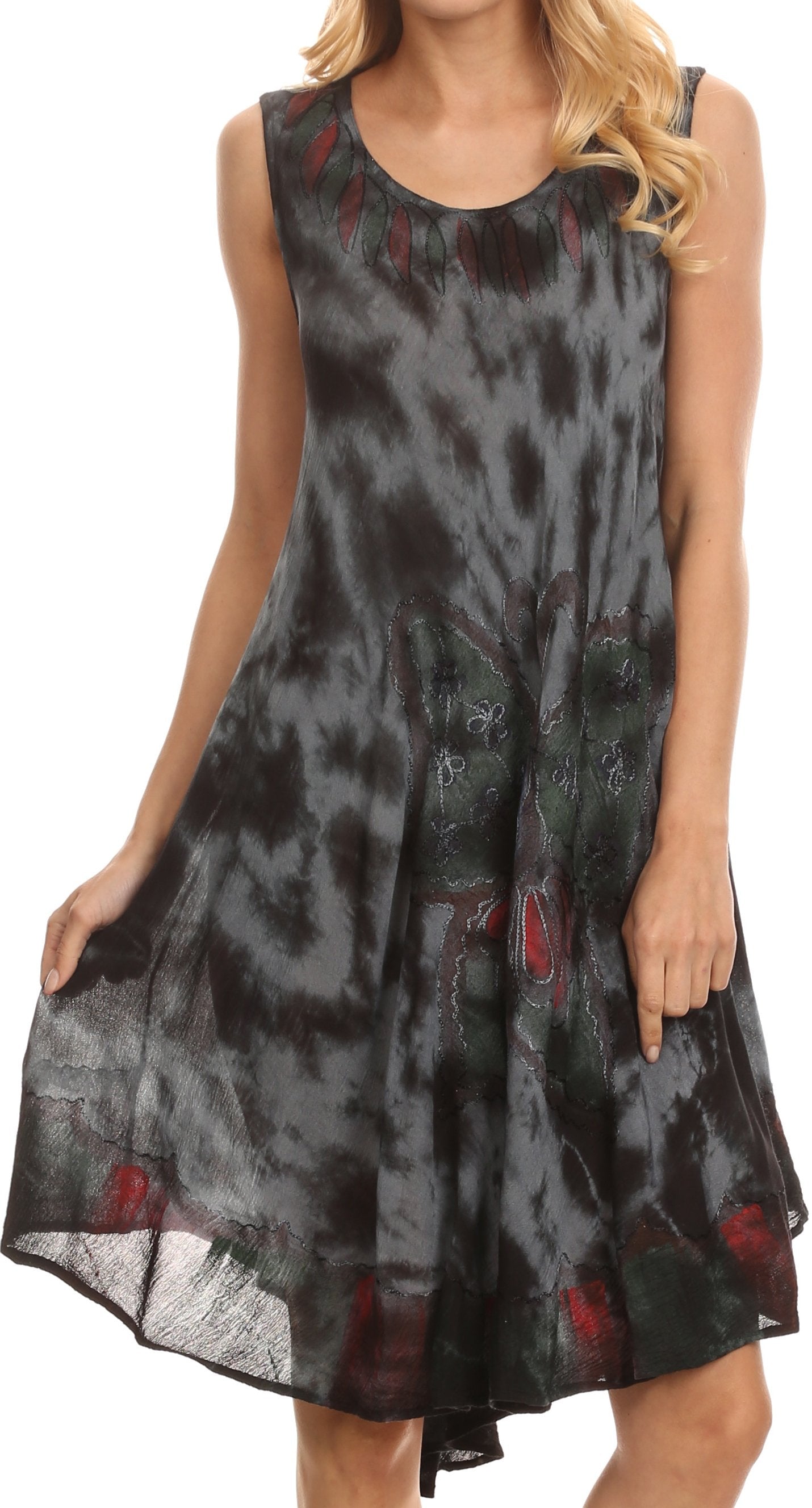 Woman wearing a sleeveless dress with black and red abstract pattern on a white background