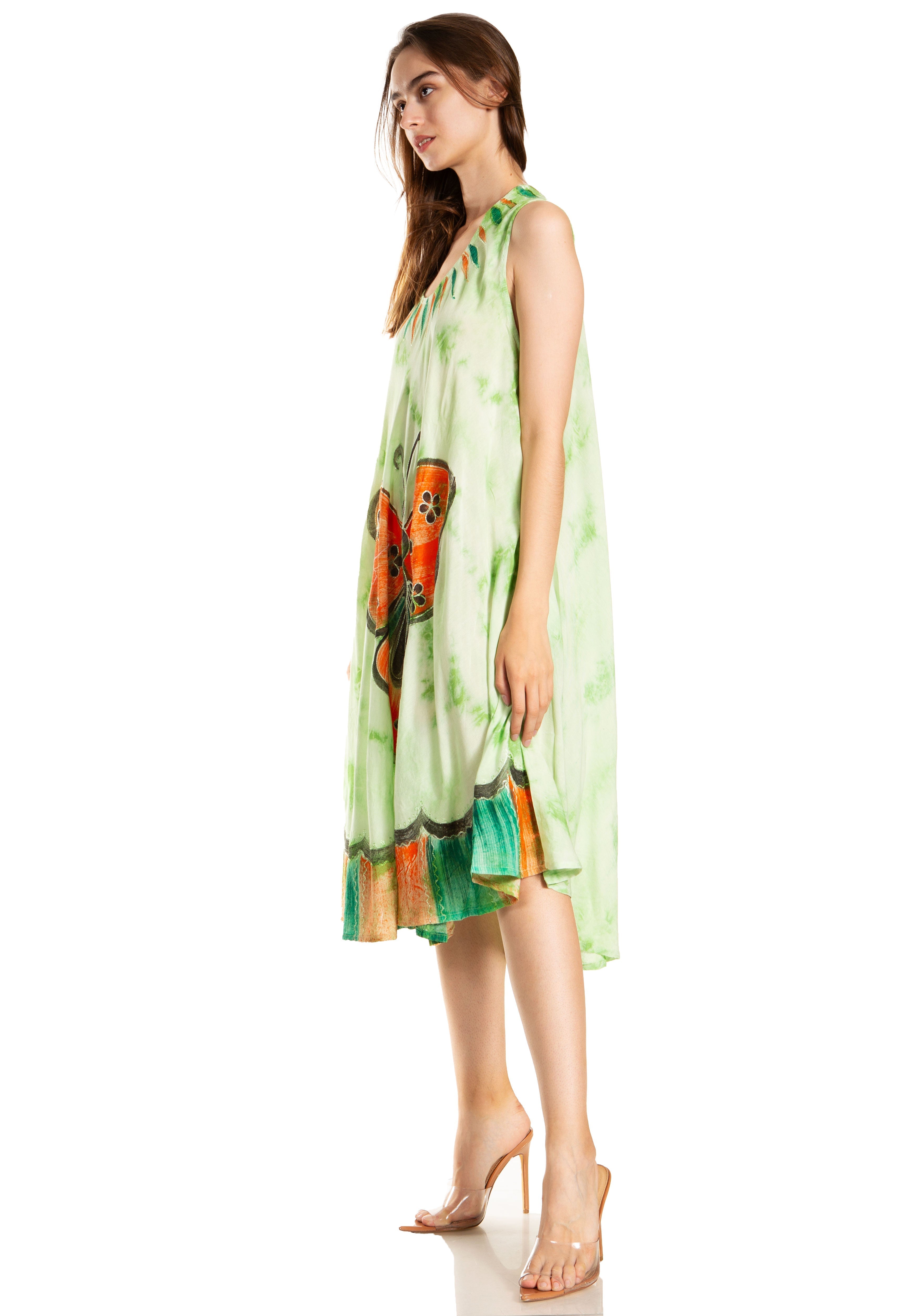 Woman wearing a sleeveless dress with butterfly design on a white background