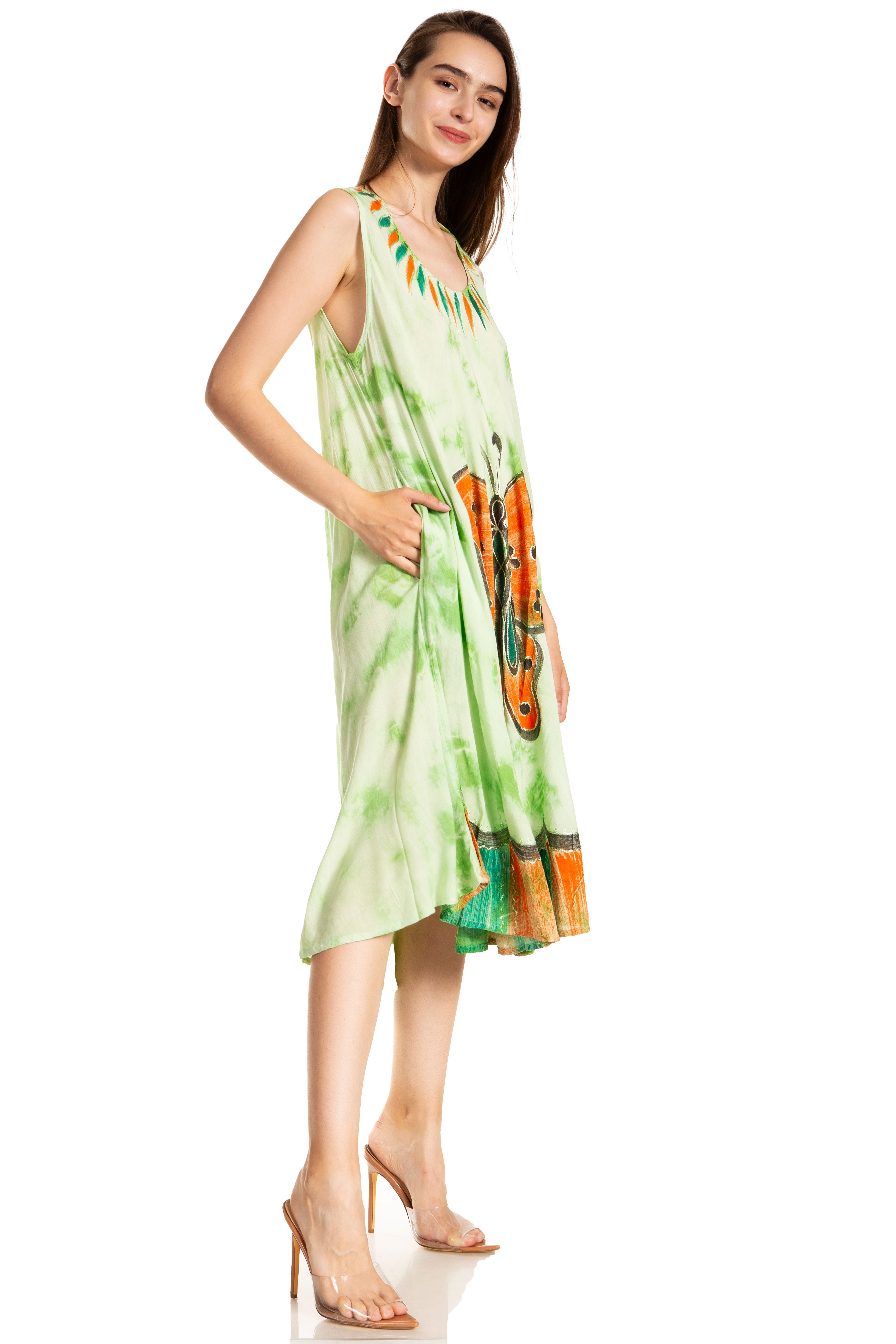 Woman wearing a green dress with floral patterns on a white background
