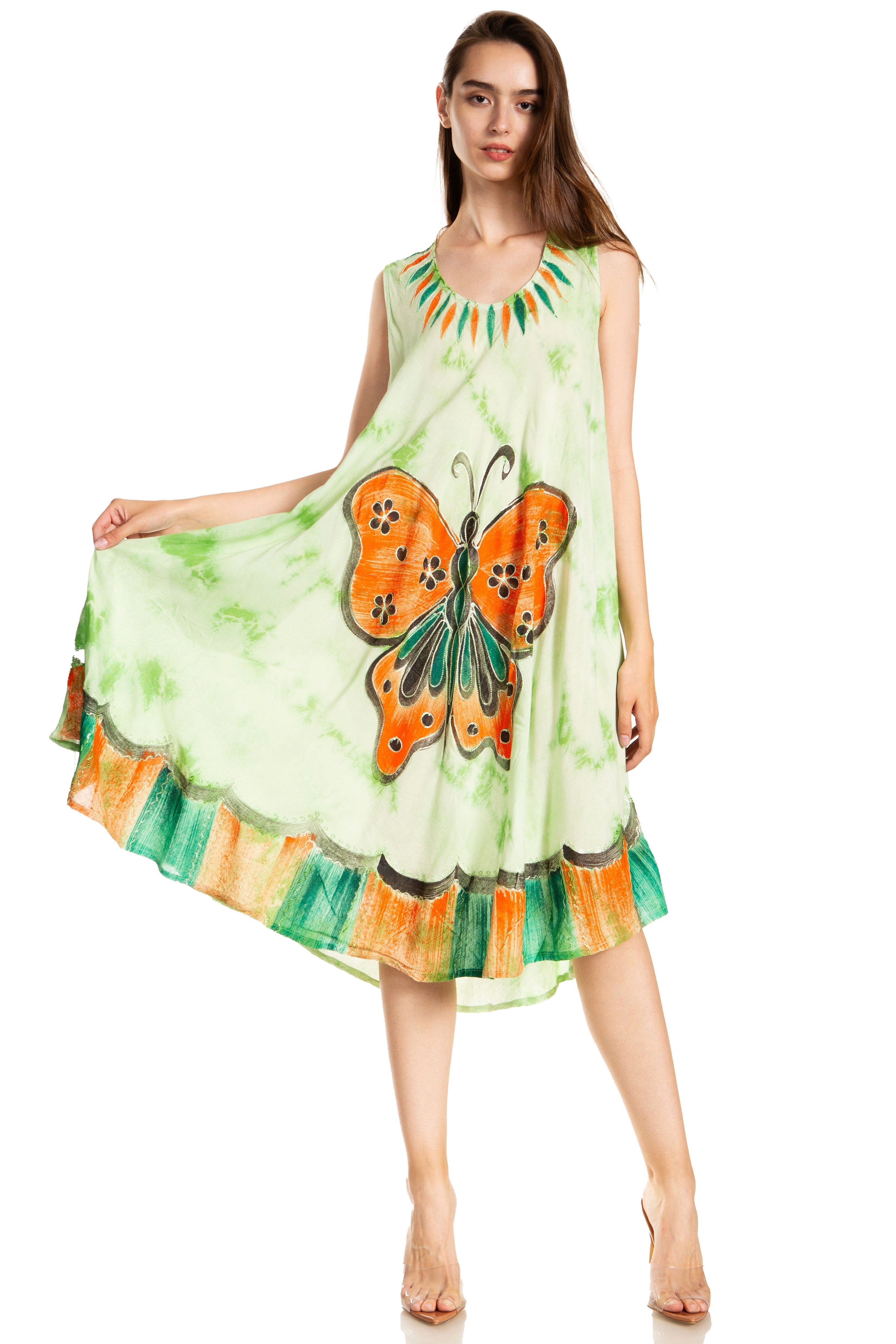 Woman wearing a green dress with a butterfly design on a white background