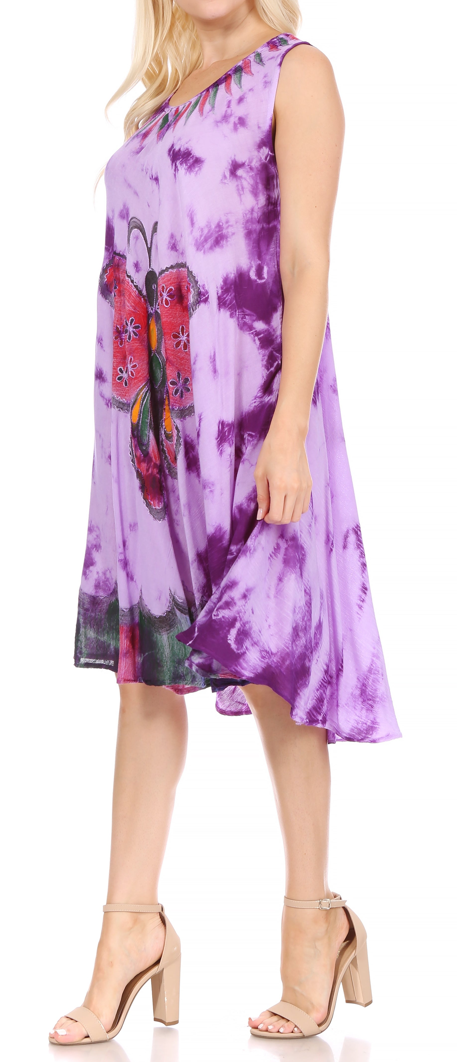 Woman wearing a purple tie-dye dress with butterfly design