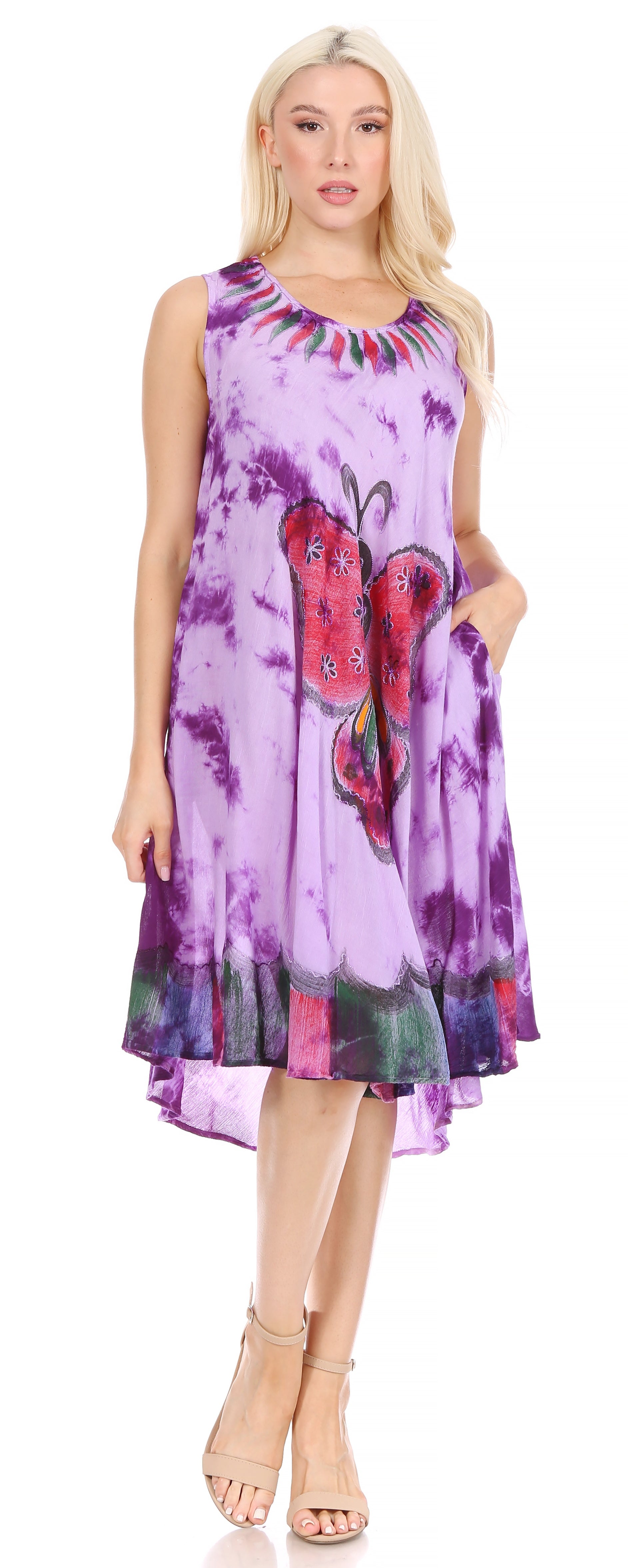 Woman wearing a colorful dress with butterfly design on a white background