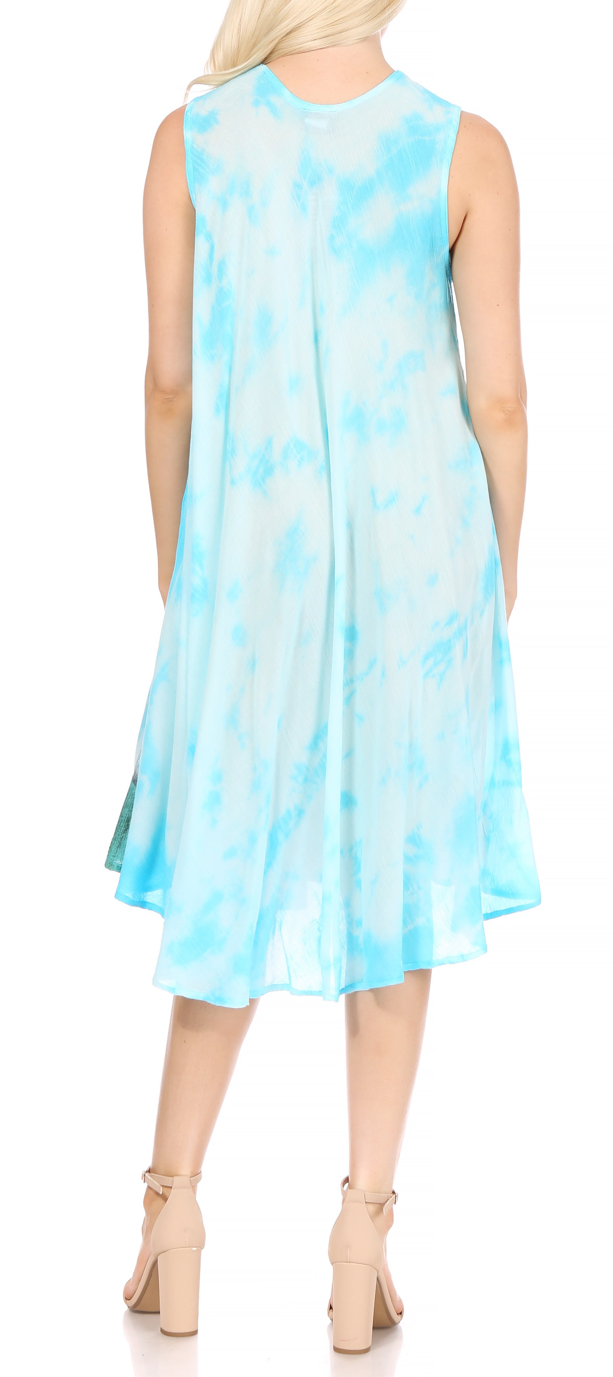 Woman wearing a light blue tie-dye dress on a white background