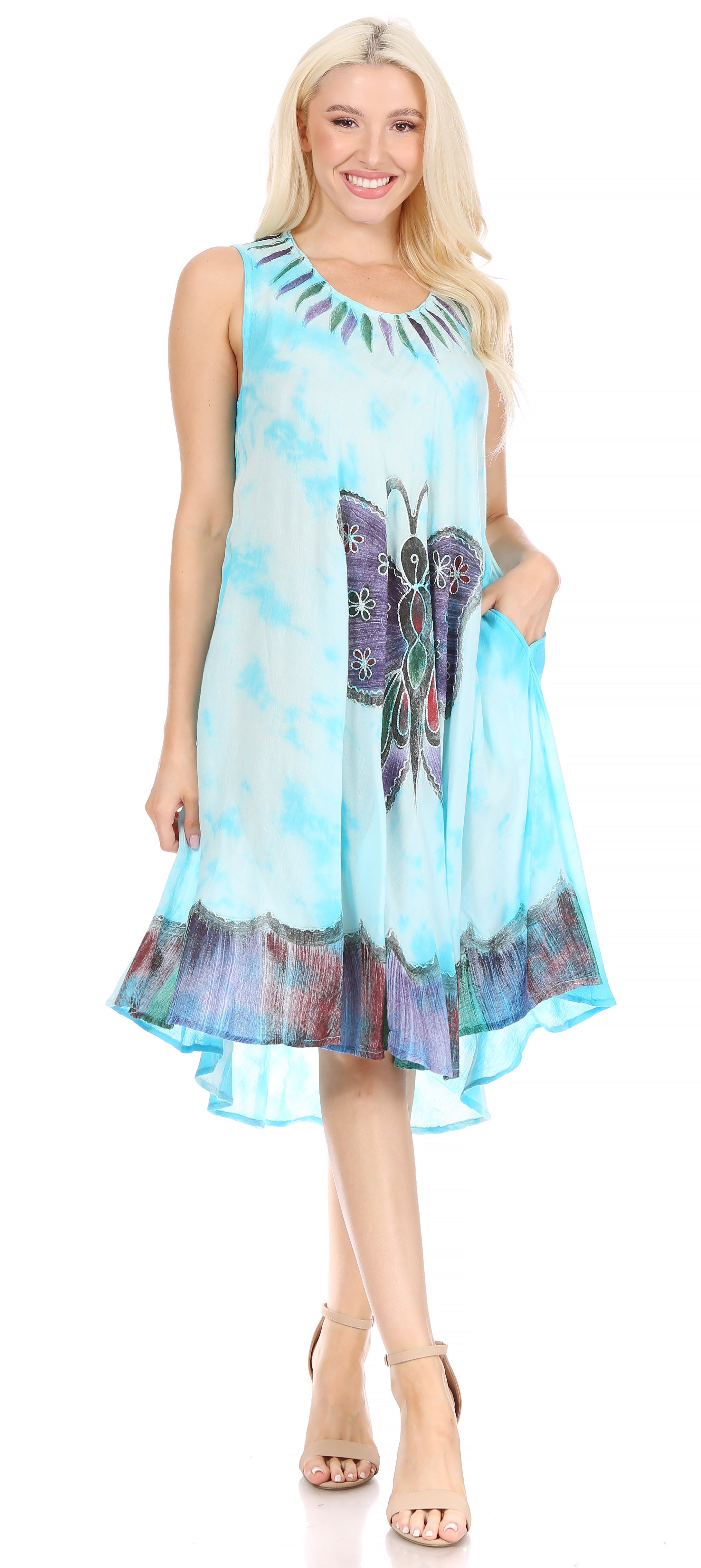 Woman wearing a sleeveless dress with butterfly design on a white background