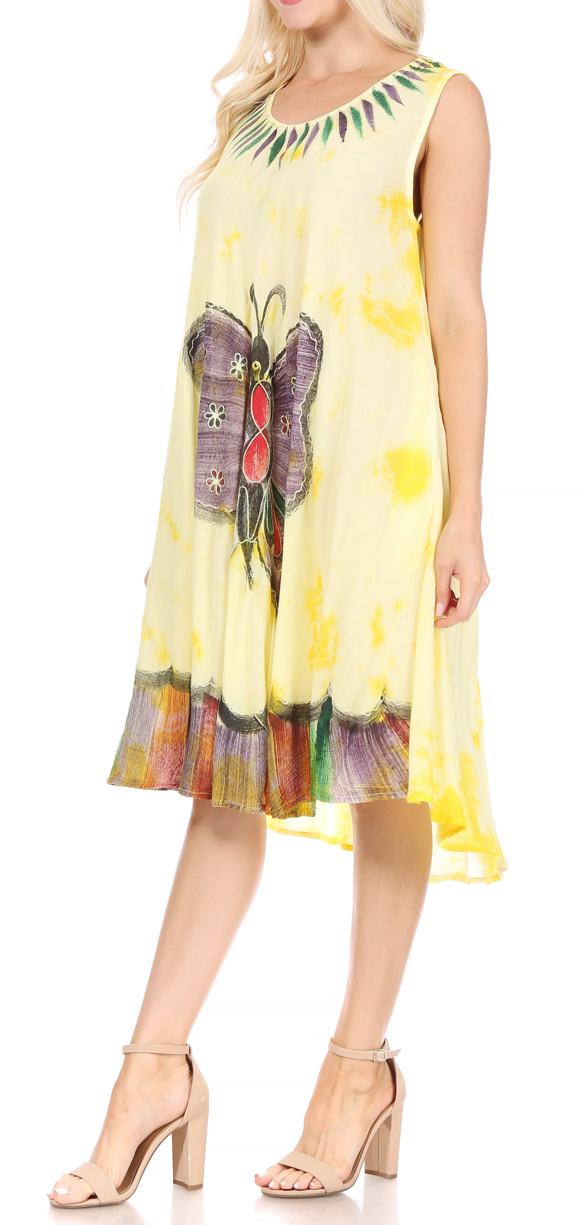 Woman wearing a yellow dress with butterfly design on a white background