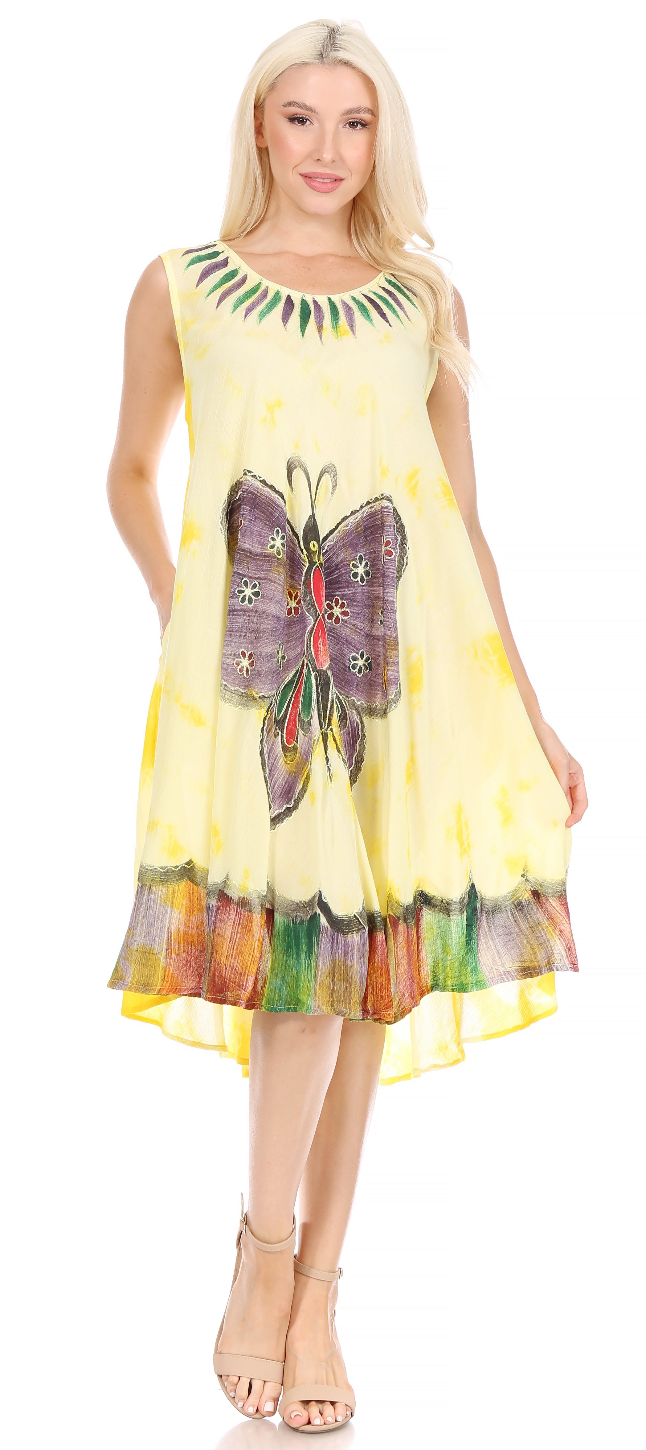 Woman wearing a colorful dress with butterfly design on a white background
