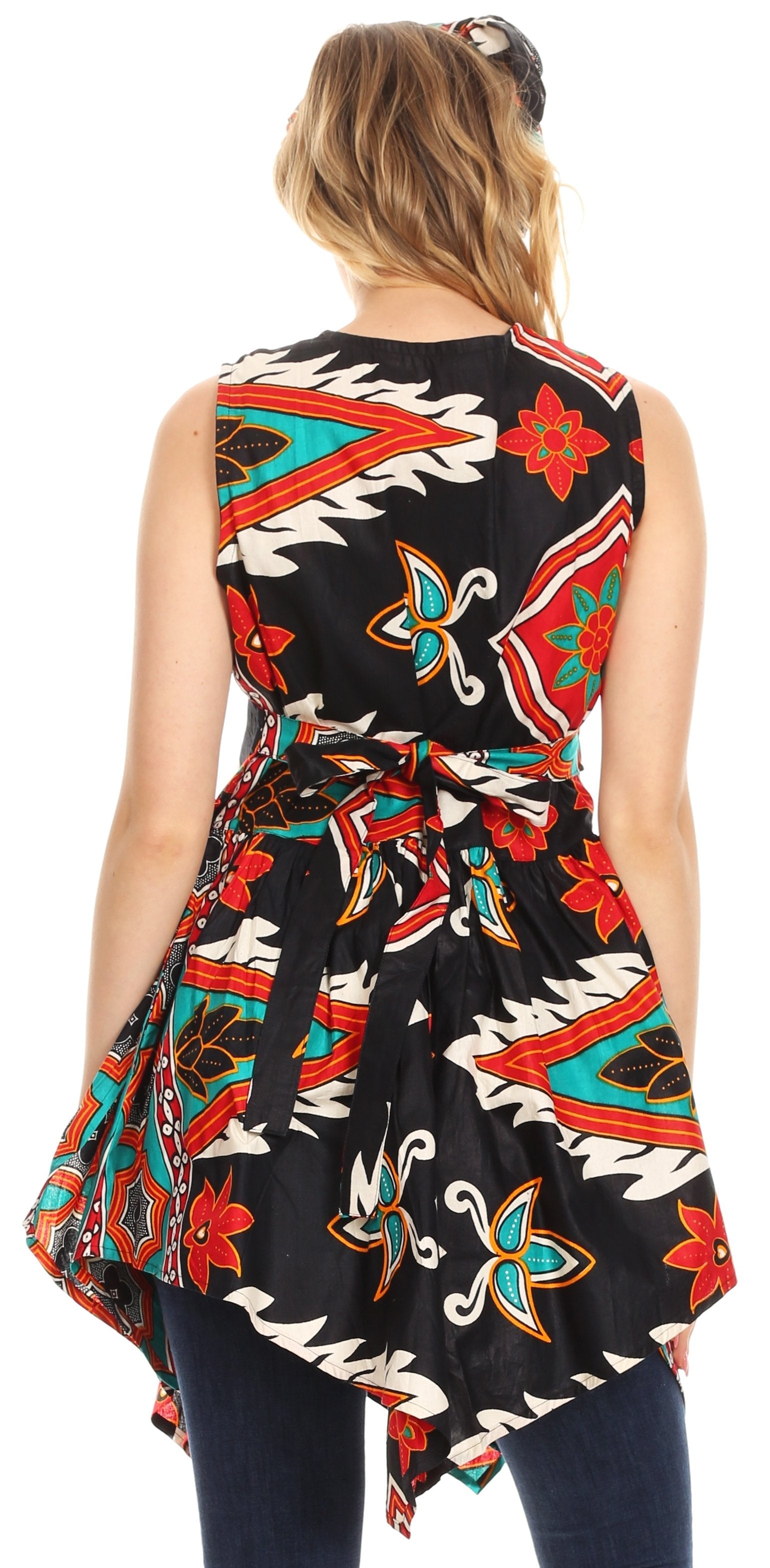 Woman wearing a sleeveless dress with a colorful geometric pattern on a white background