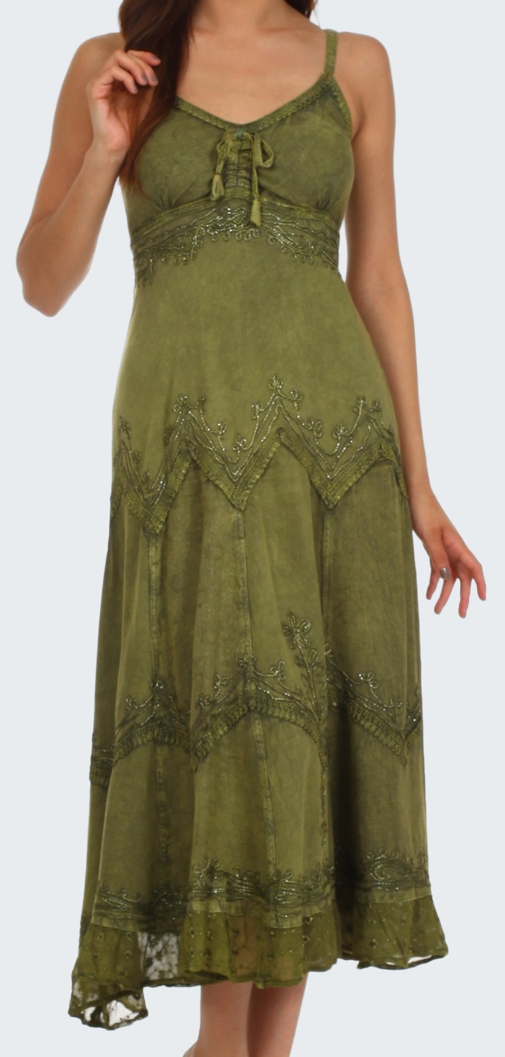 Green dress with intricate patterns on a white background