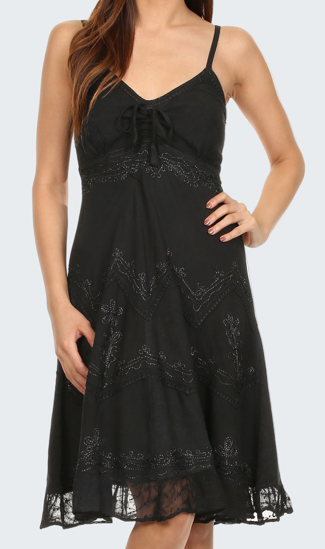 Black lace dress worn by a model on a white background