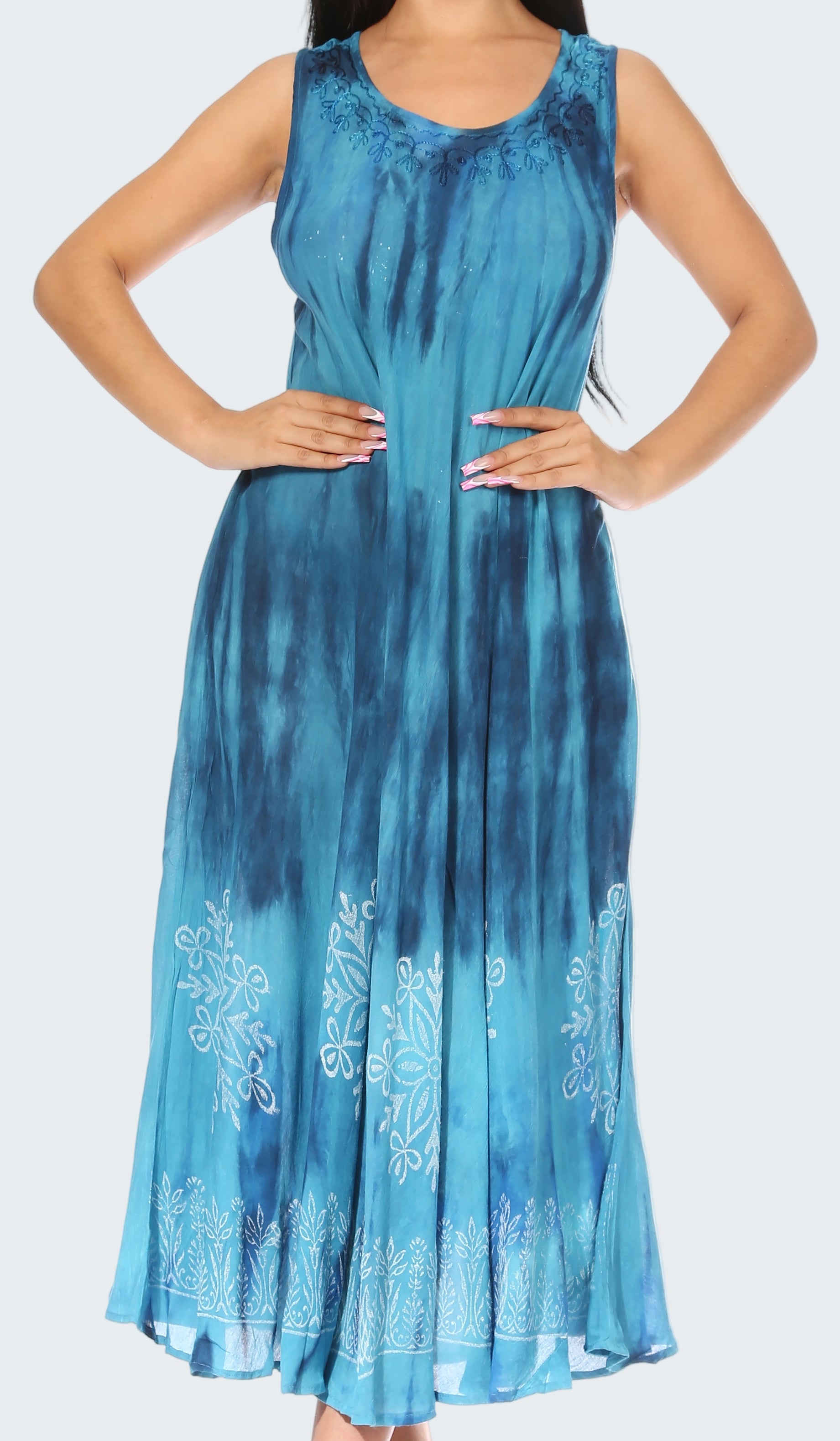 Blue tie-dye dress with white floral embroidery on a white background