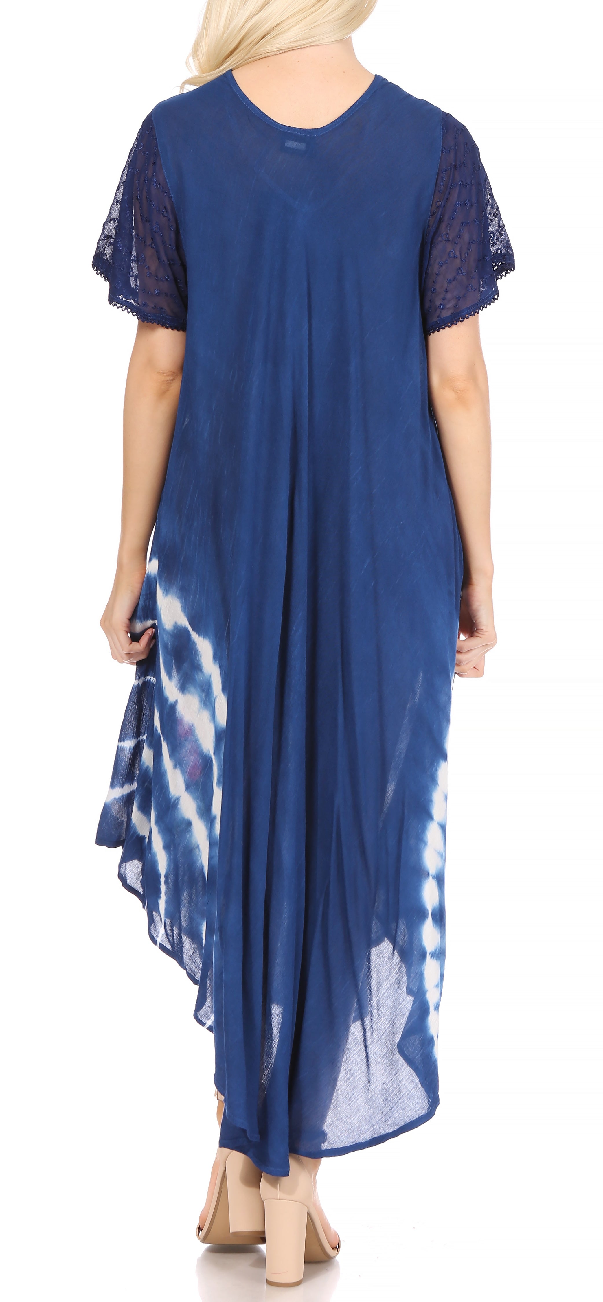 Woman wearing a blue dress with tie-dye pattern on a white background