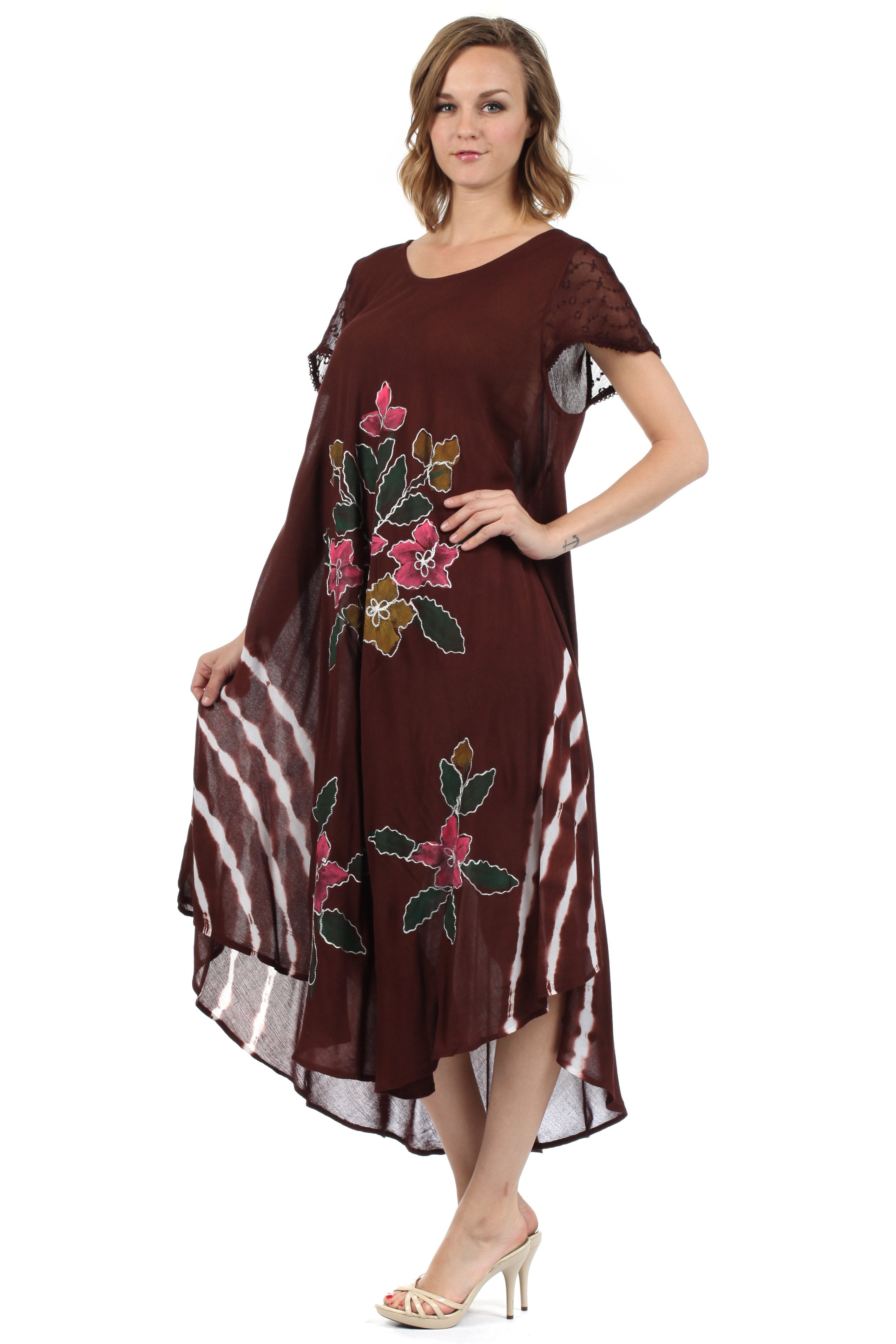 Woman wearing a brown dress with floral patterns on a white background