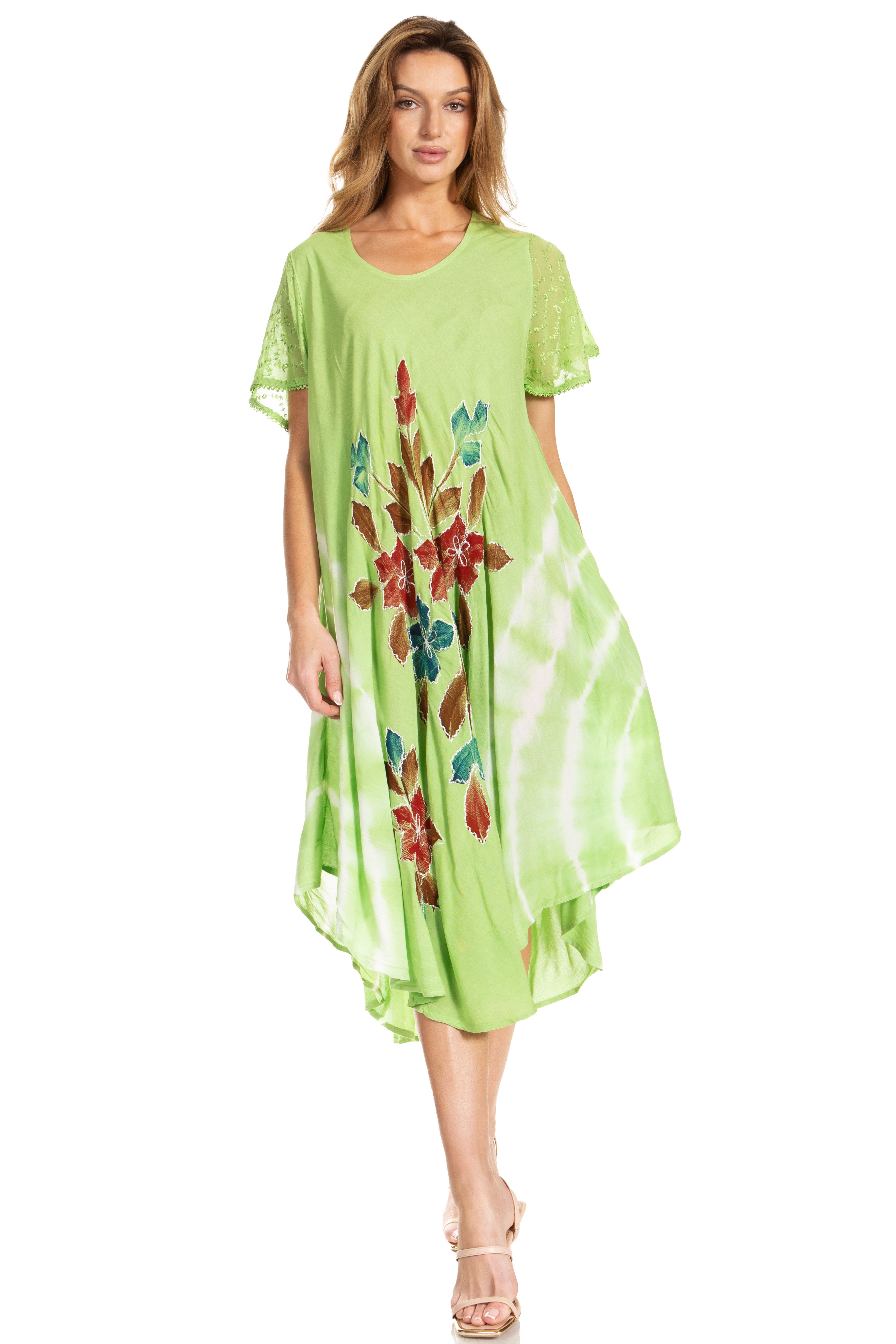 Woman wearing a green dress with floral patterns on a white background