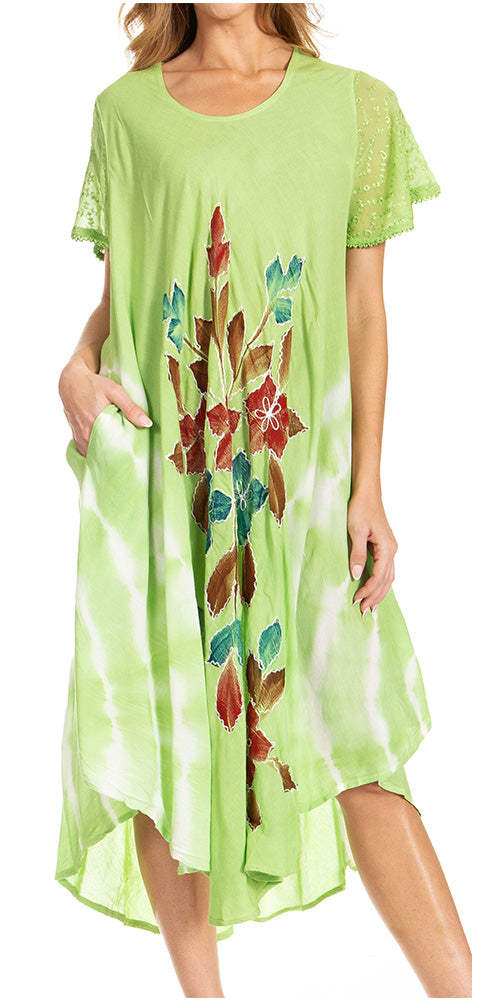 Woman wearing a green dress with floral patterns on a white background