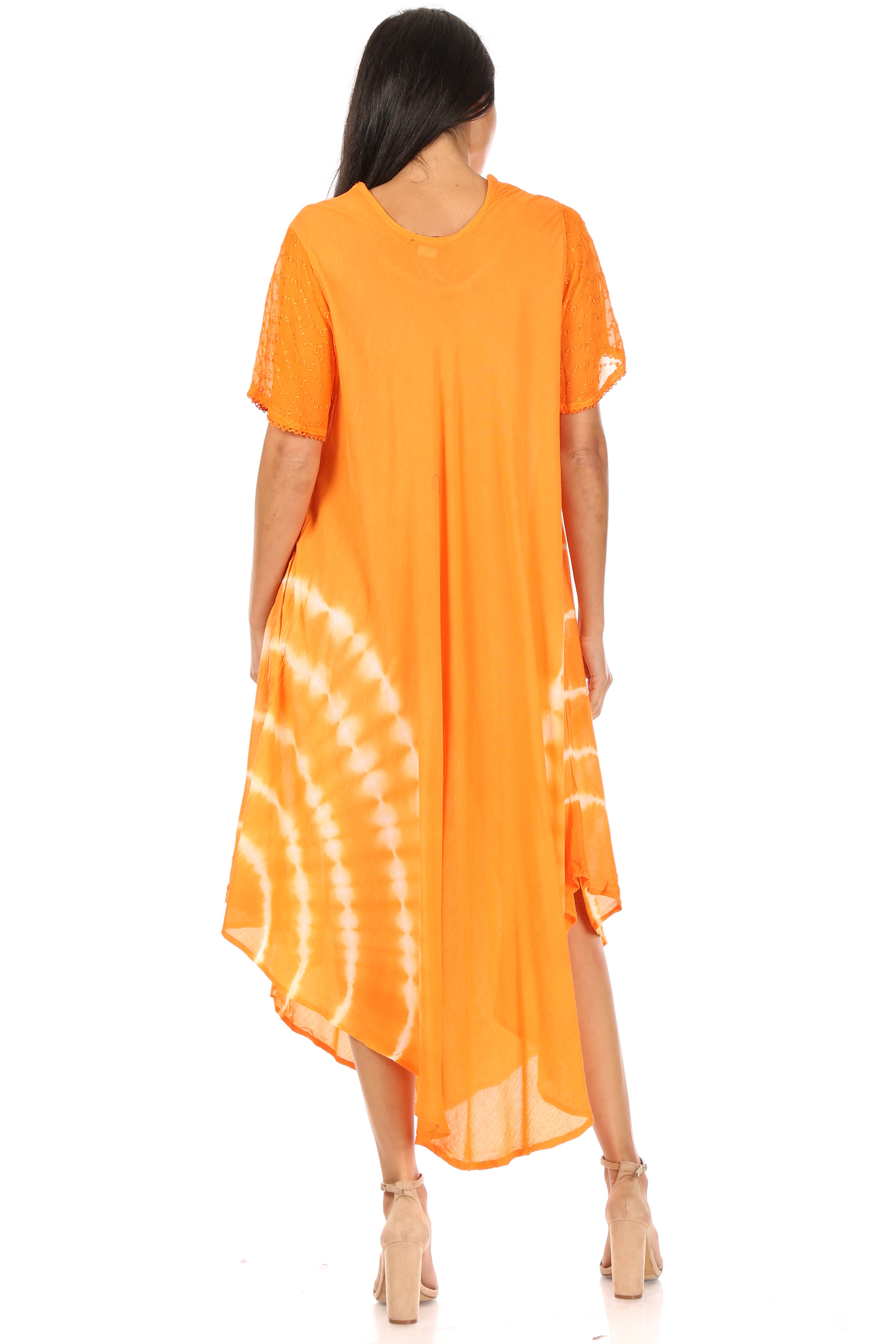 Woman wearing an orange tie-dye dress on a white background