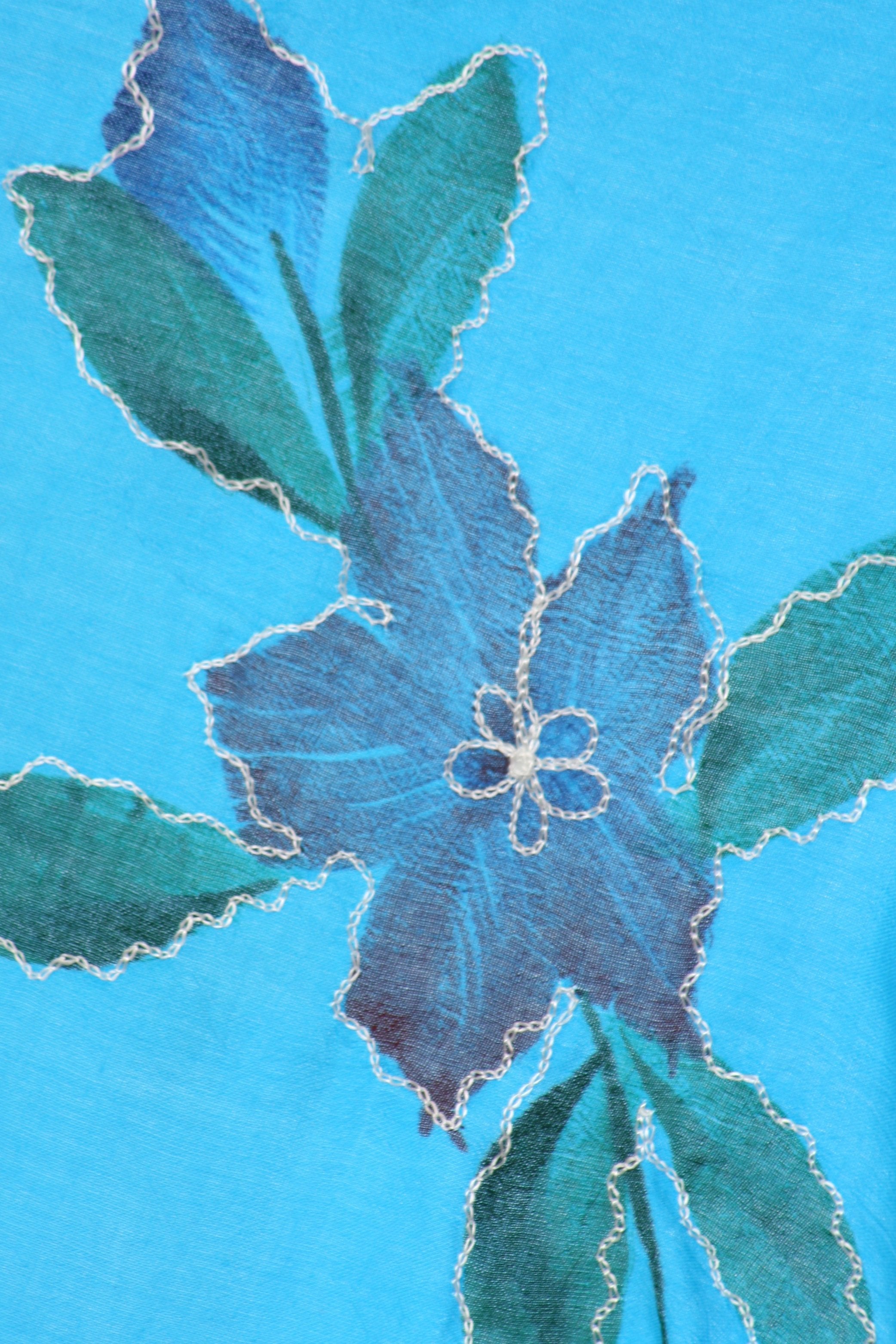 Blue and green floral design on a blue background