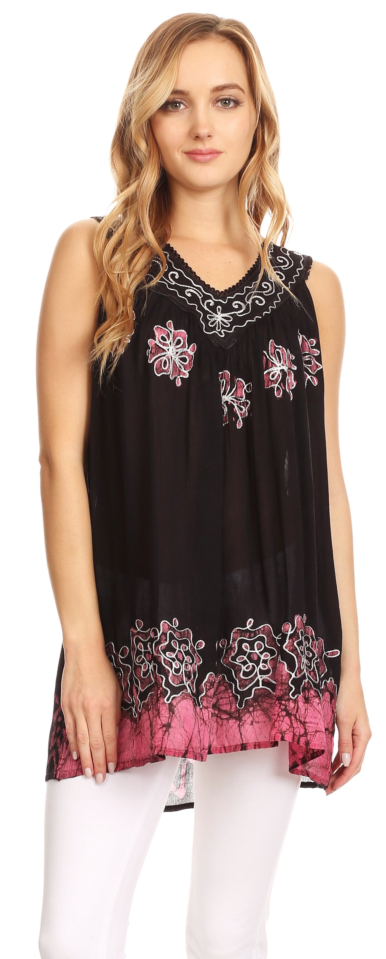 Woman wearing a black and pink sleeveless top with floral embroidery on a white background
