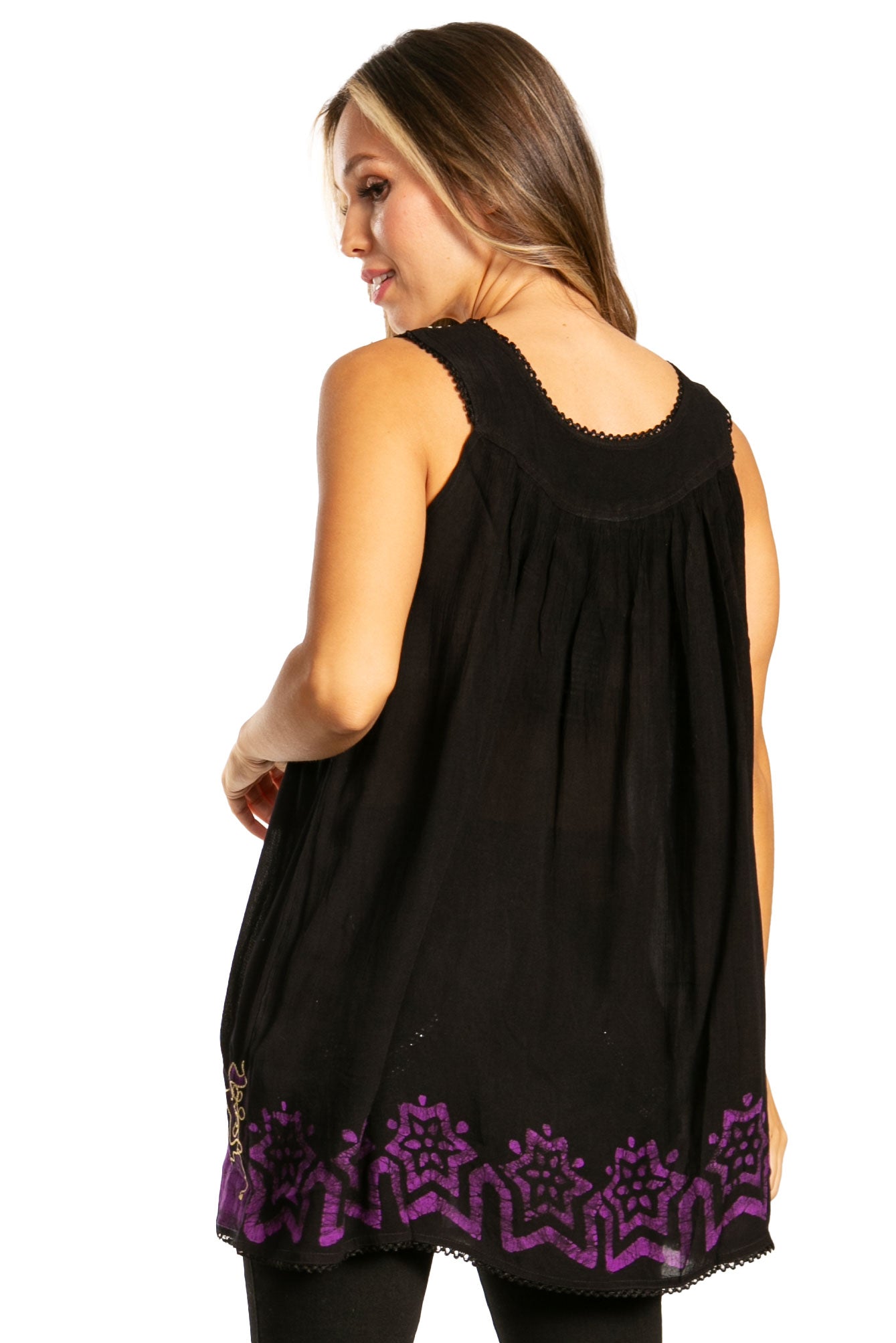 Woman wearing a black sleeveless top with purple lace details on a white background