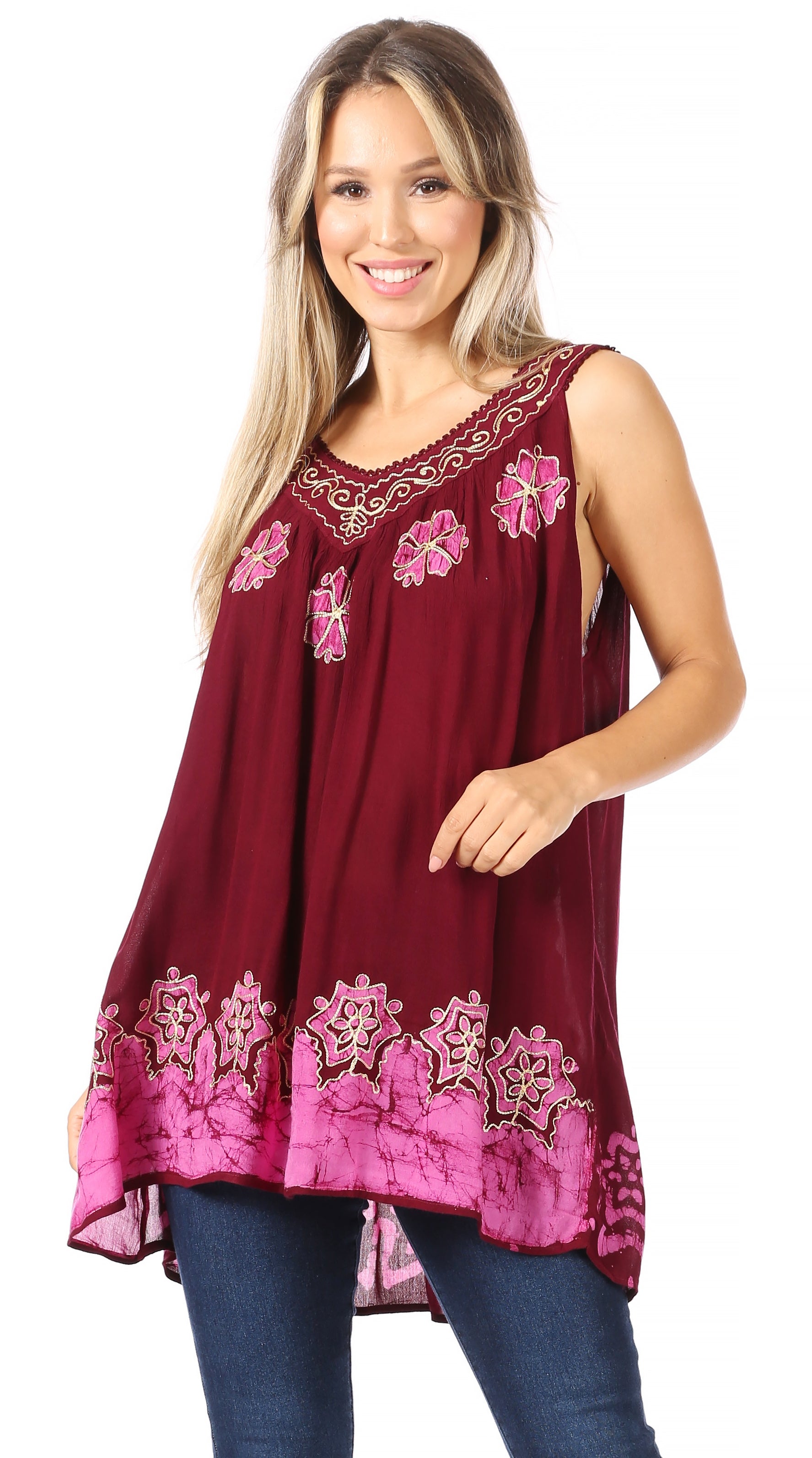 Woman wearing a burgundy sleeveless top with floral embroidery on a white background
