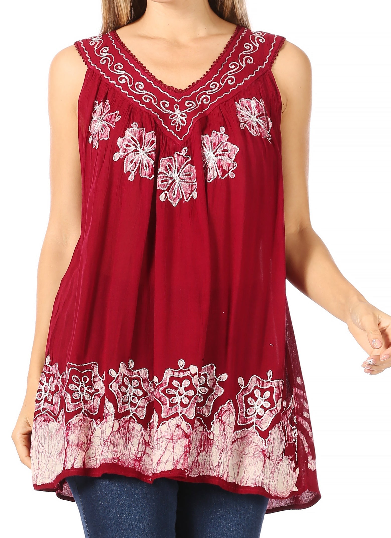 Red sleeveless top with white floral embroidery on a white background