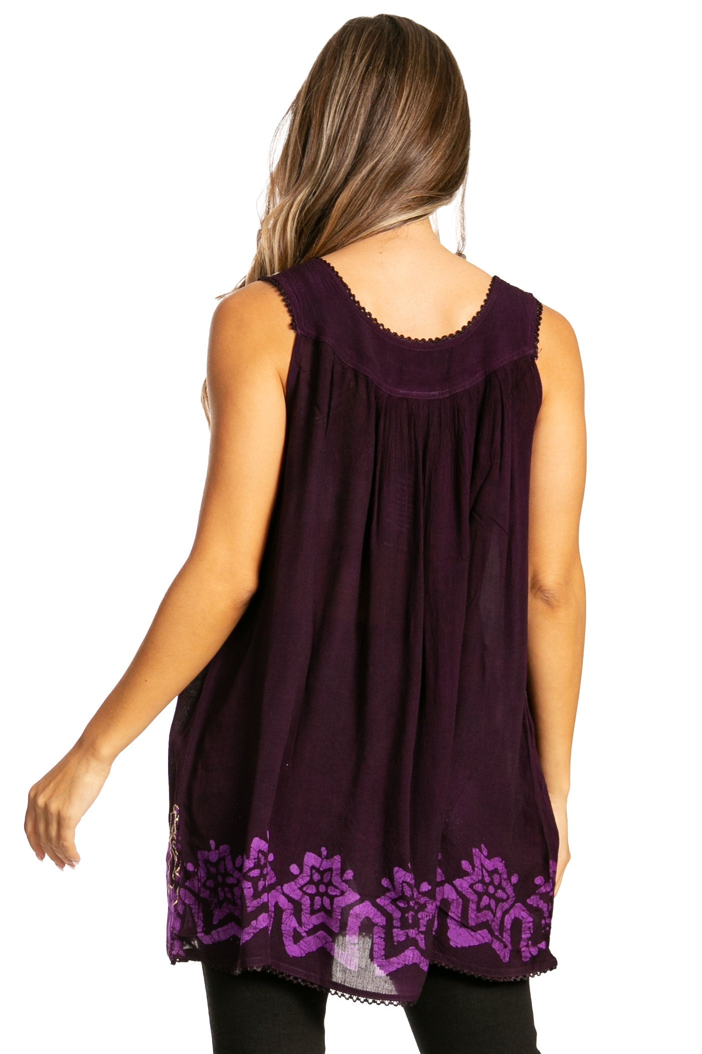 Woman wearing a sleeveless purple top with floral embroidery on a white background