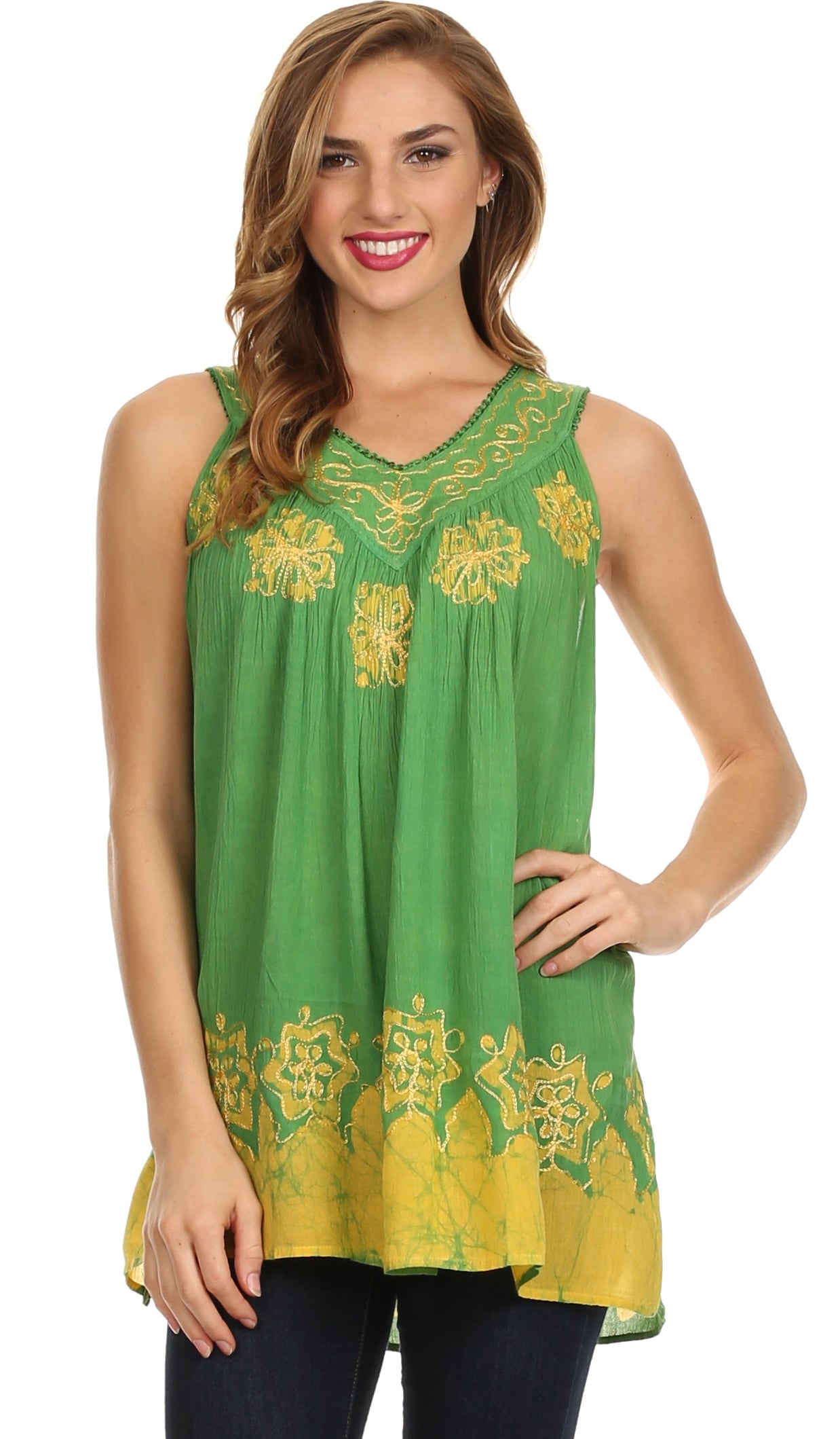 Woman wearing a green sleeveless top with yellow floral embroidery on a white background