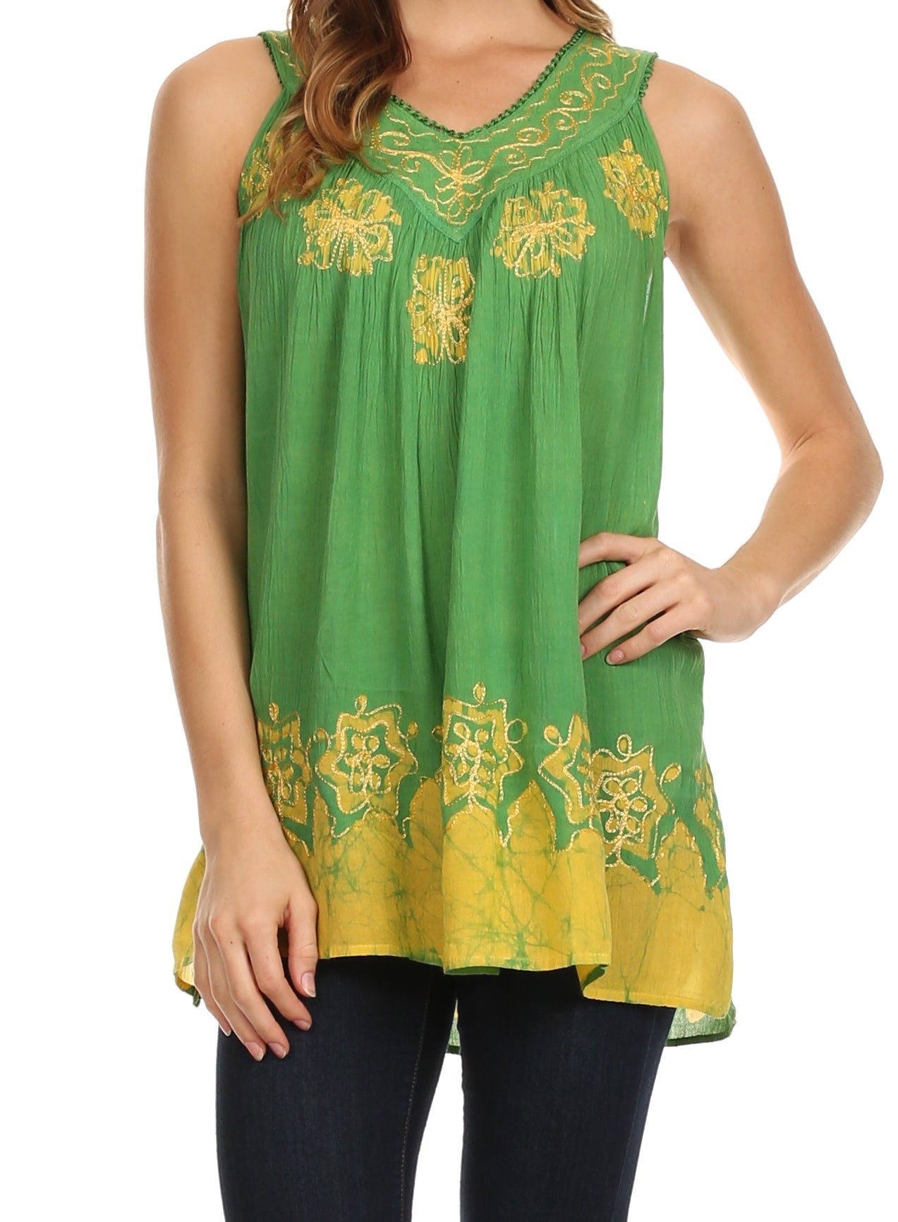 Green sleeveless top with yellow embroidery worn by a person on a white background