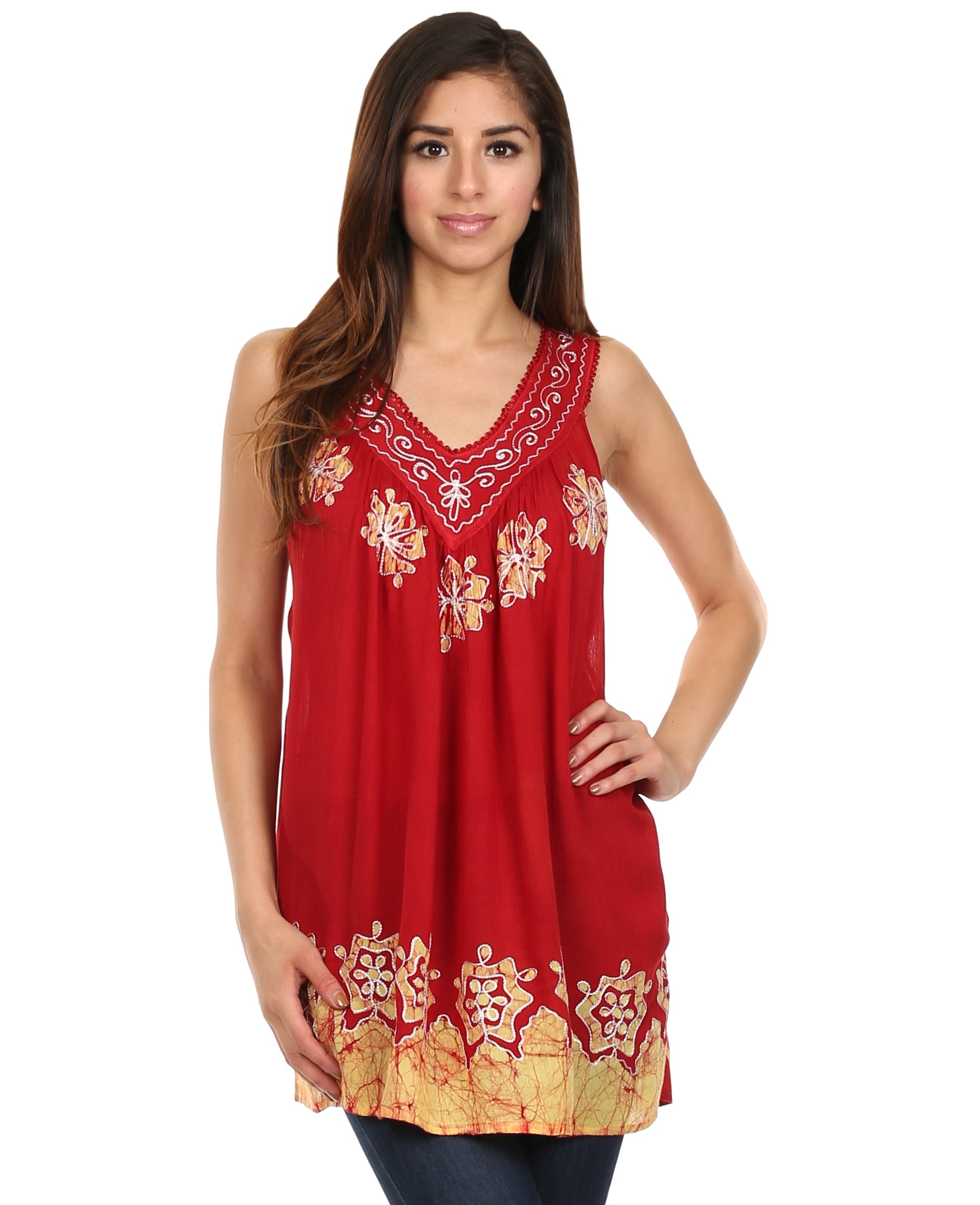 Woman wearing a red sleeveless top with gold embroidery on a white background
