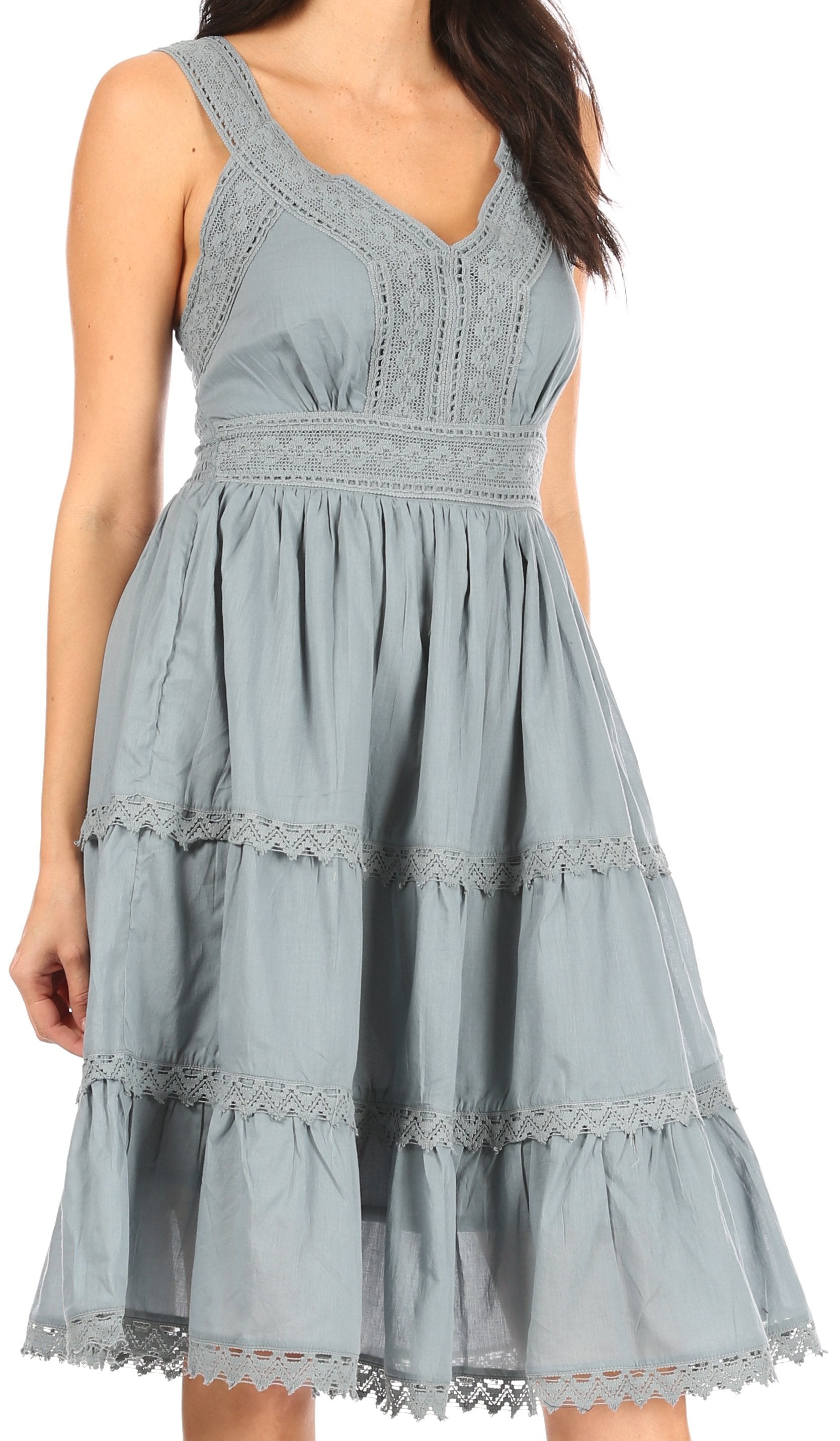 Light blue dress with lace details on a white background