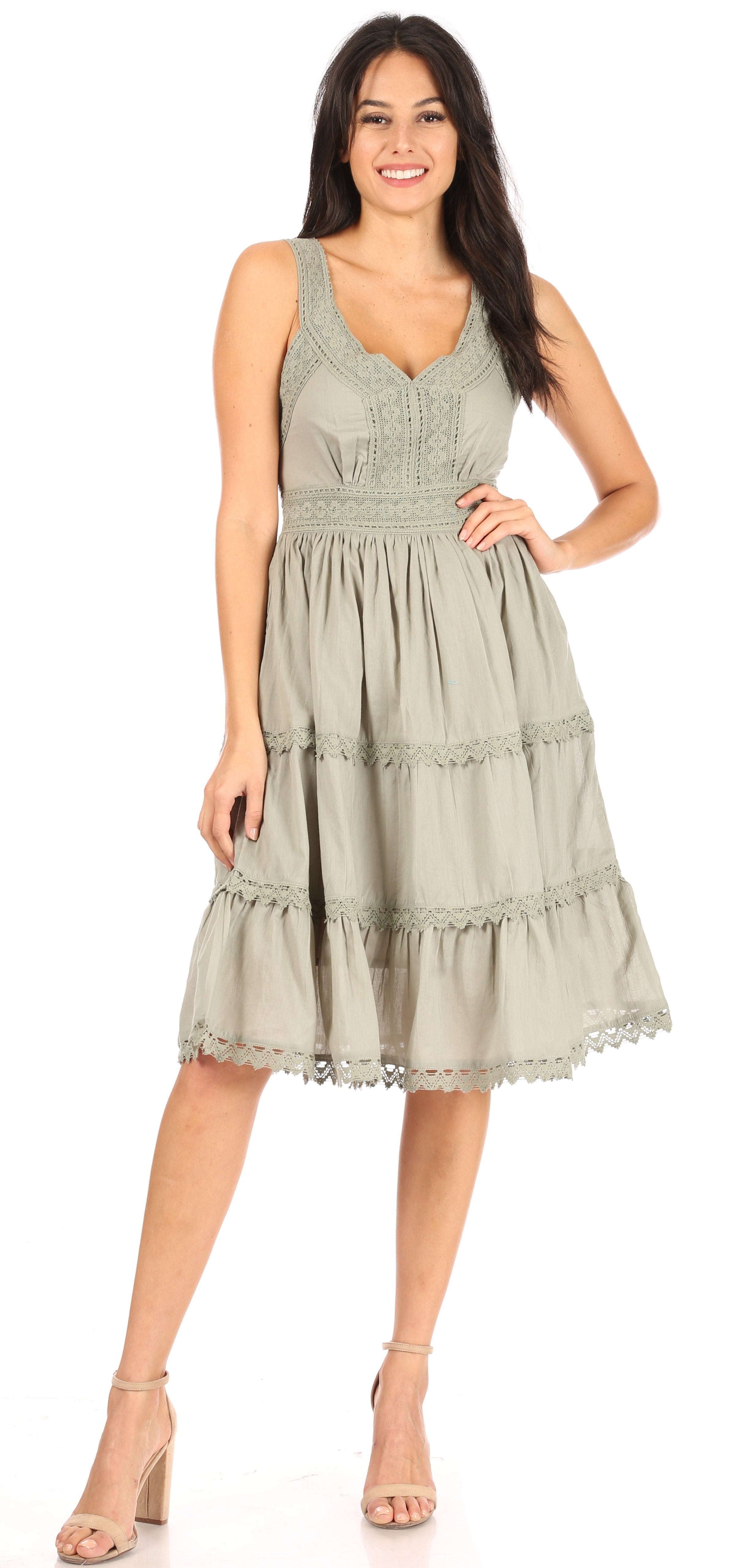 Woman wearing a green dress on a white background