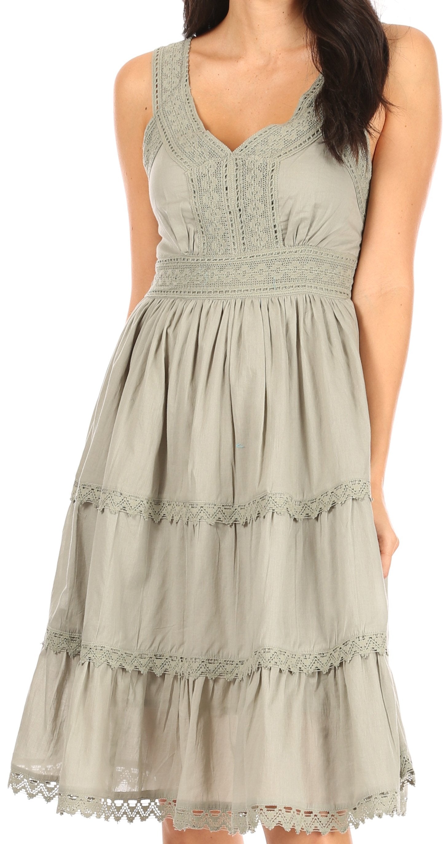 Light green dress with lace details on a white background