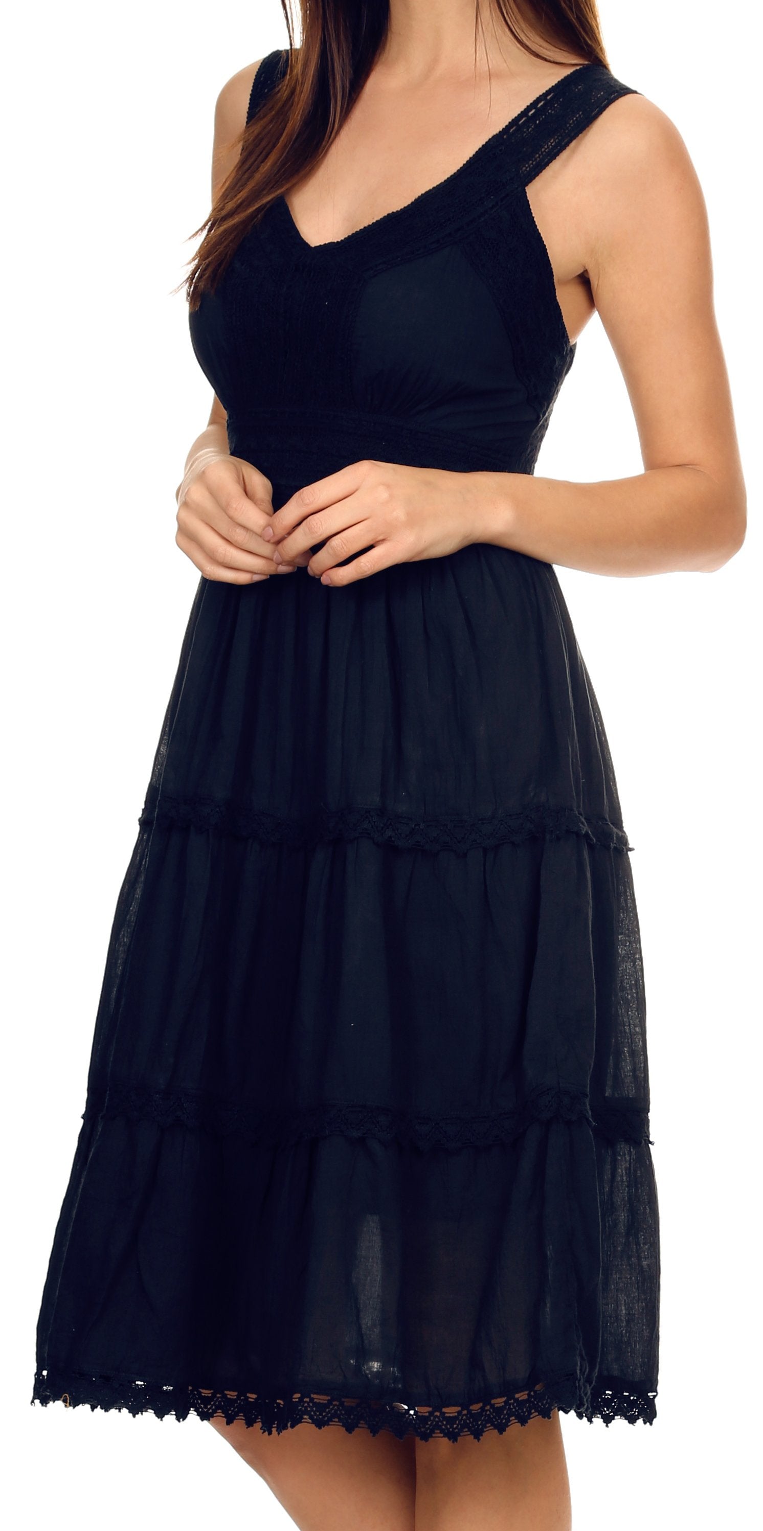 Navy blue dress with lace details on a white background