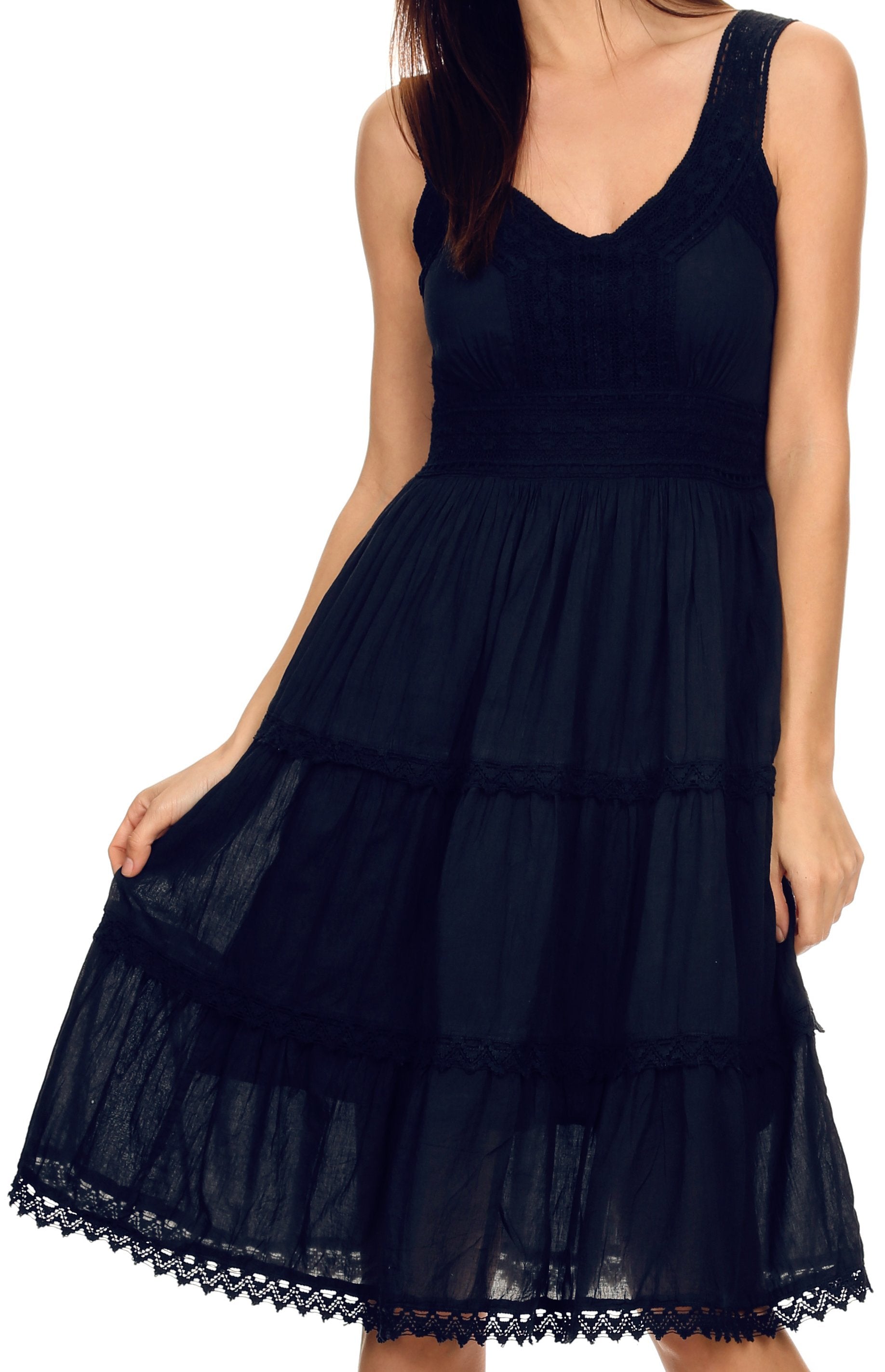 Black sleeveless dress with lace details on a white background