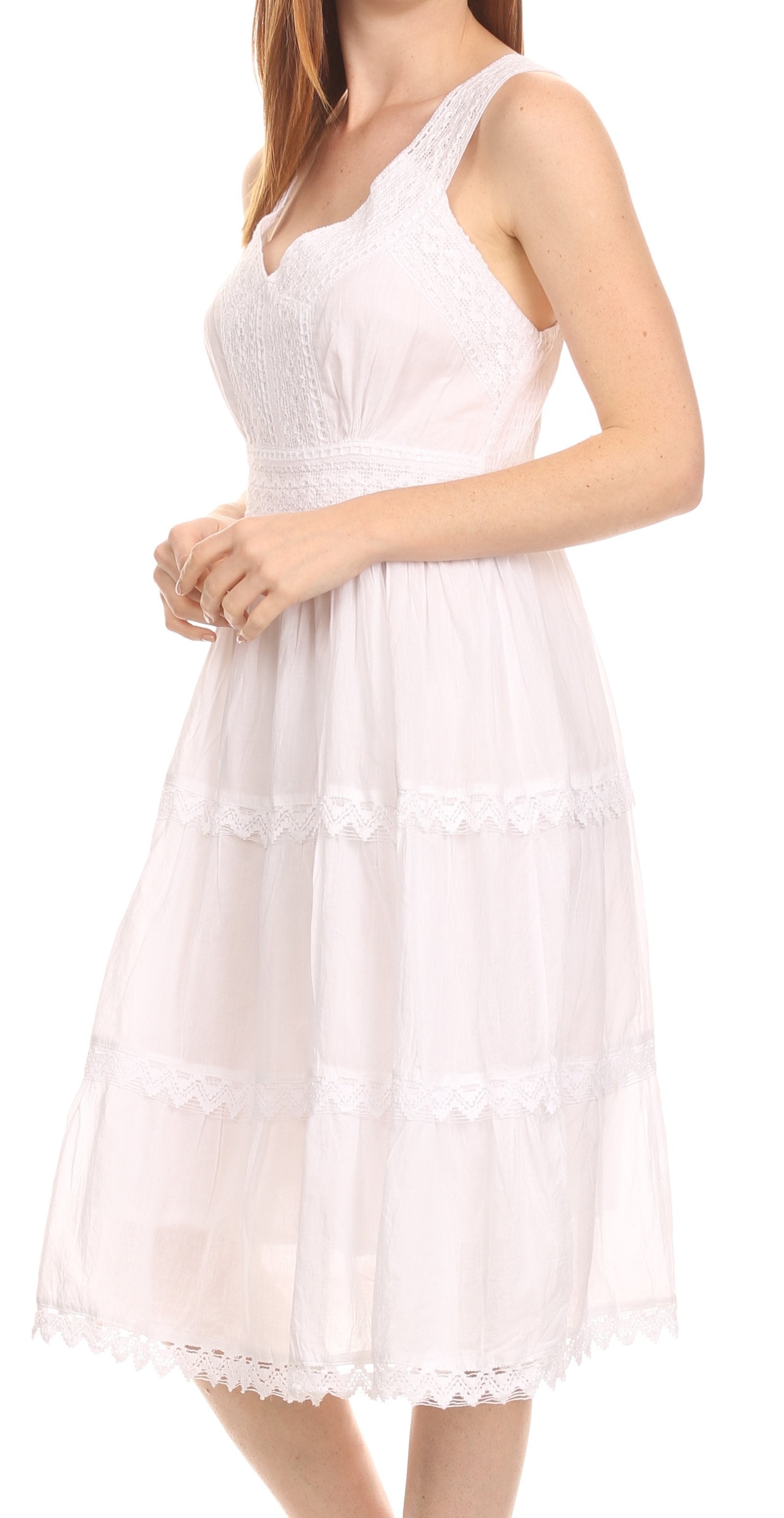 White lace dress worn by a model on a white background