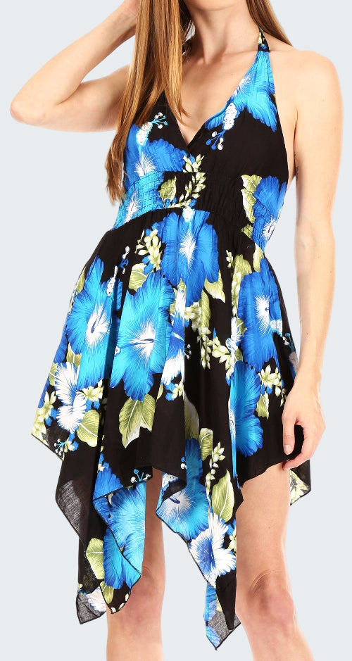 Woman wearing a blue floral dress with a black background